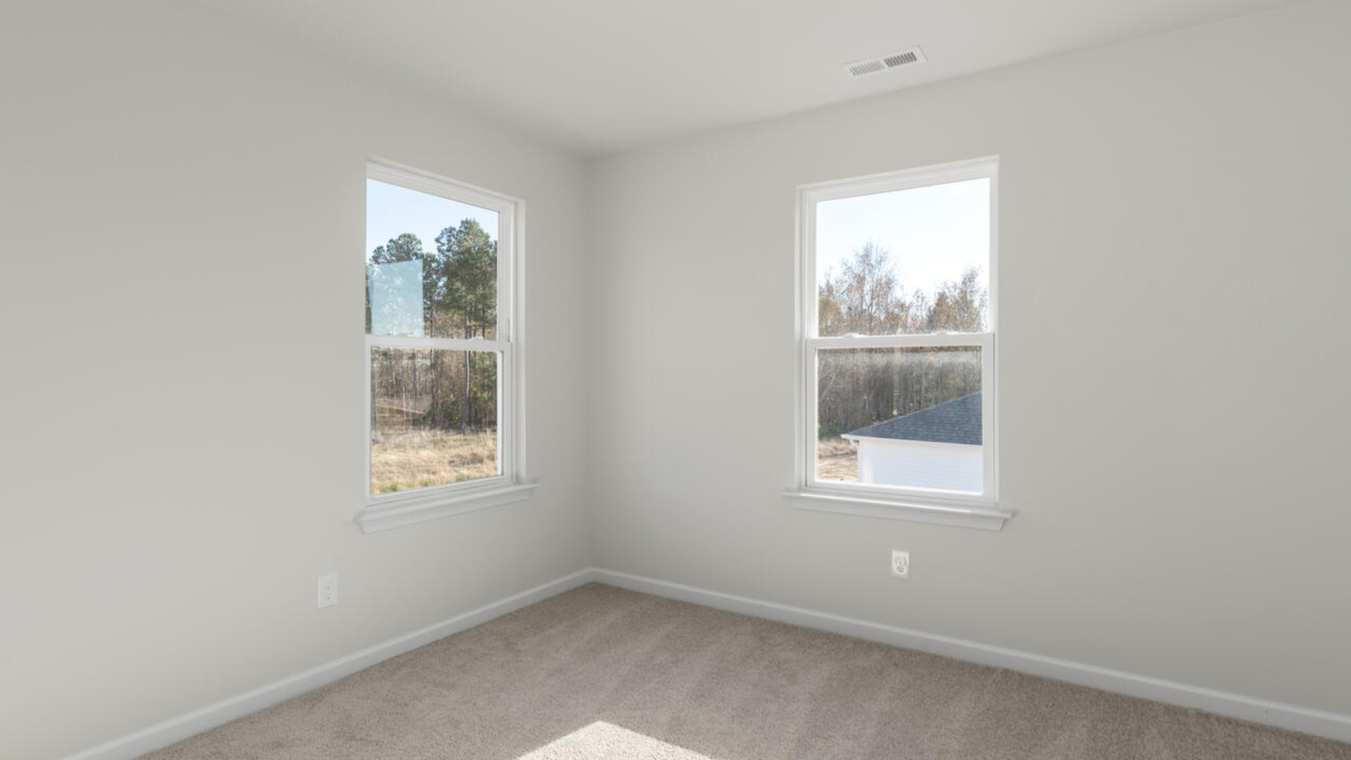 . The large loft in the center of the second floor separates the primary suite from secondary bedrooms and offers endless possibilities—use it as a playroom, media room, or fitness area. The secondary bedrooms are spacious.