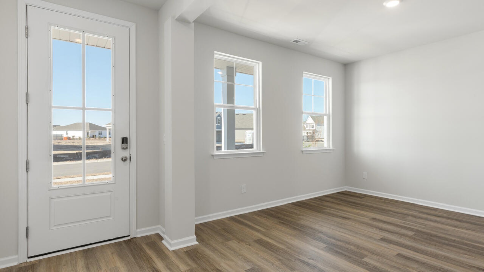 Upon entering the home, you are greeted by a wide foyer and formal dining room.