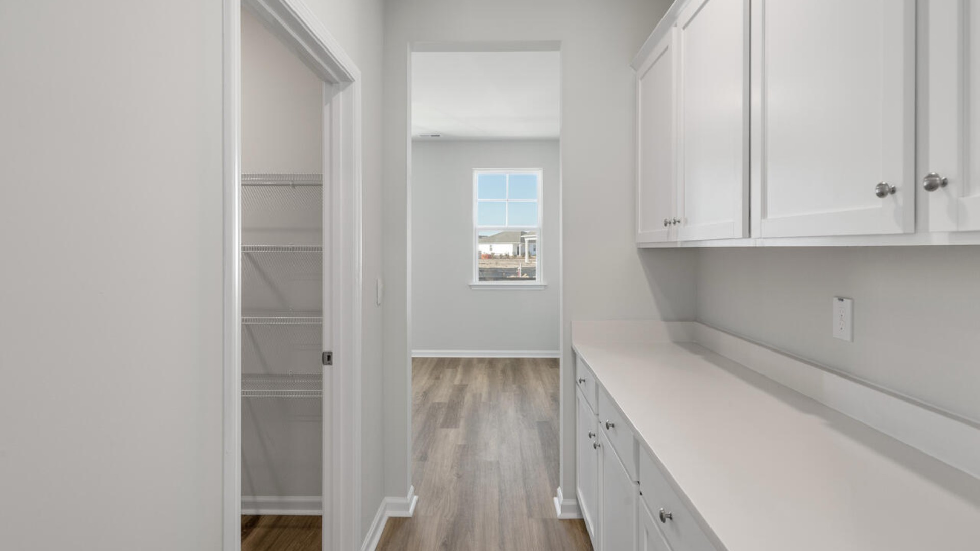 Tucked away behind the living room is a private downstairs bedroom and full bathroom. This space is perfect as a guest suite, or home office.