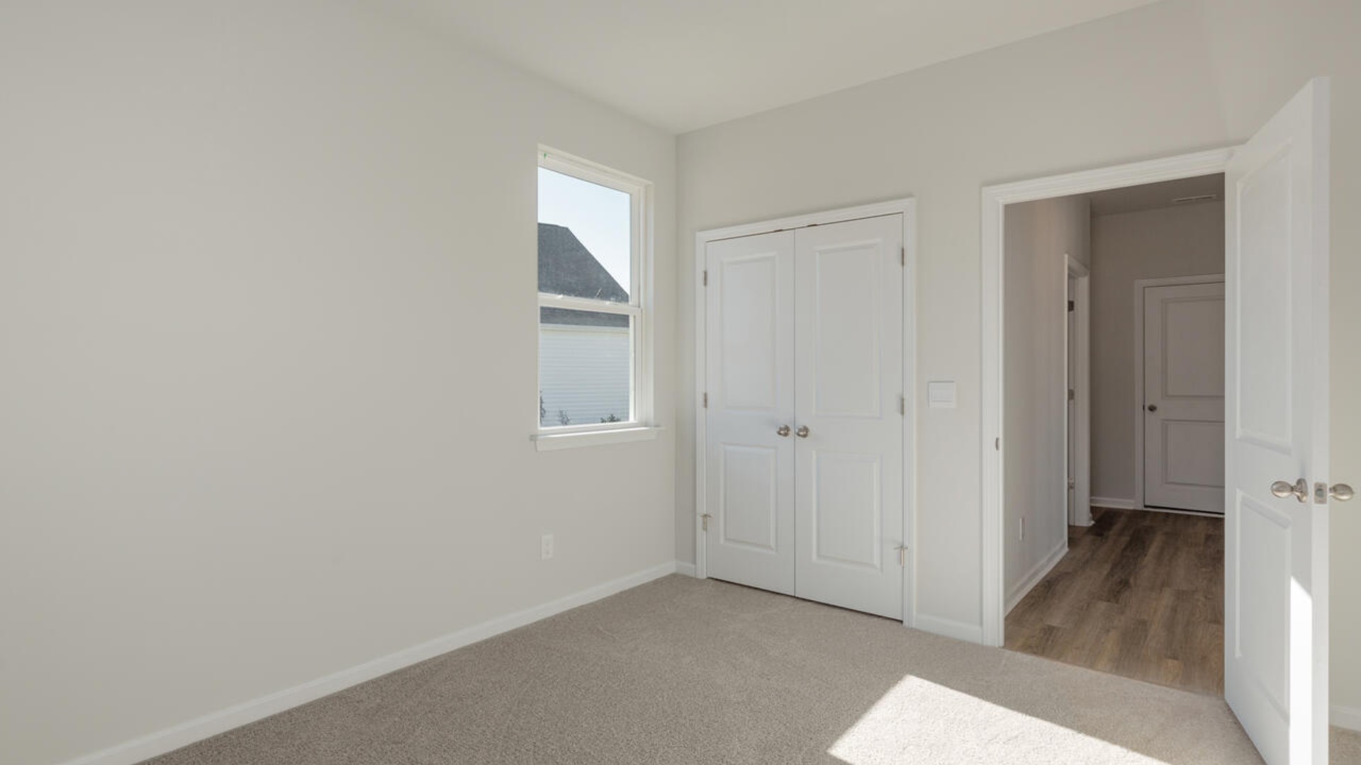 . The large loft in the center of the second floor separates the primary suite from secondary bedrooms and offers endless possibilities—use it as a playroom, media room, or fitness area. The secondary bedrooms are spacious.