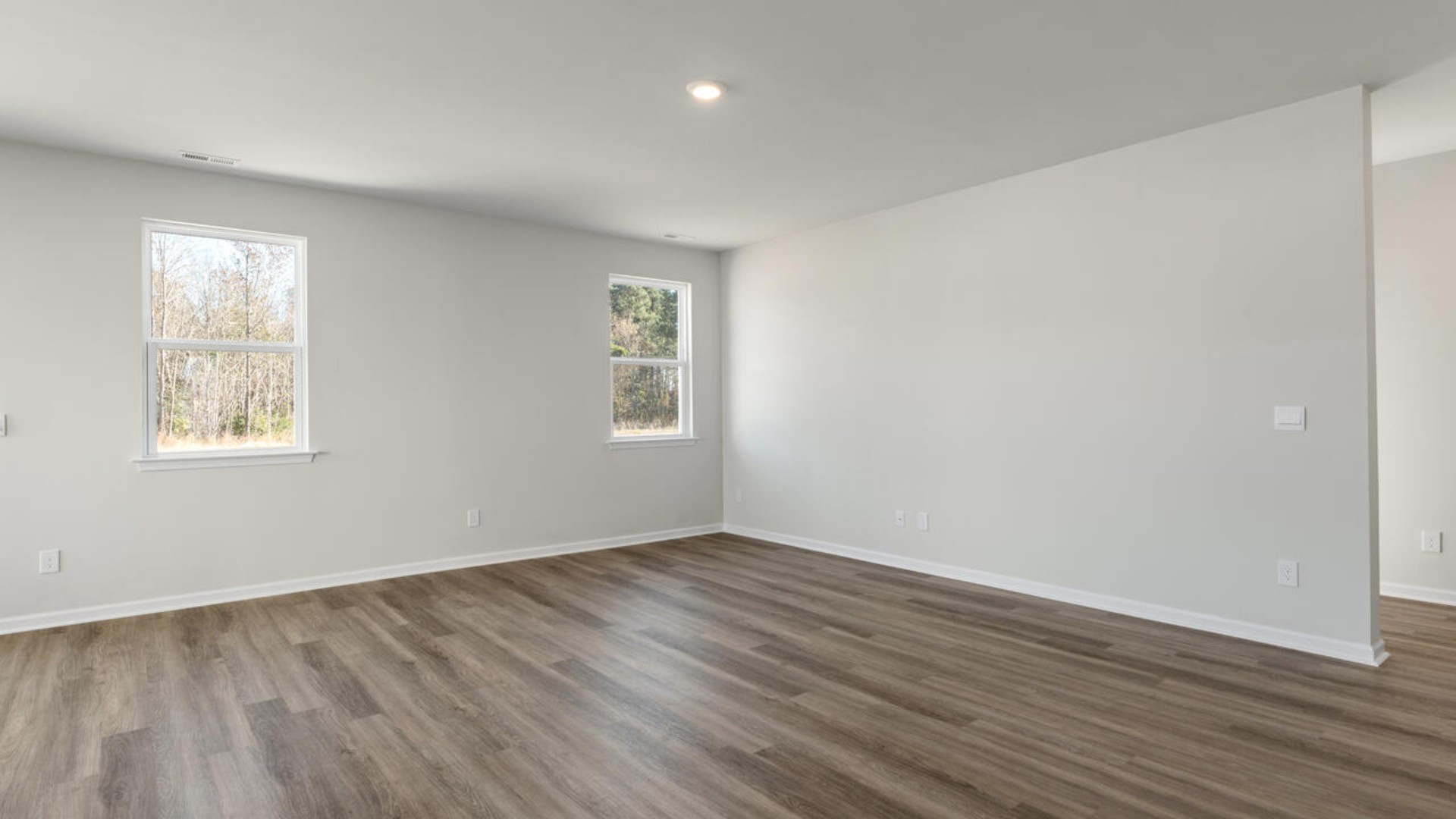 Upstairs, the primary suite is a true retreat, complete with a sitting room and large walk-in closet. The garden tub and tile shower in the en-suite bathroom give a true spa-like experience.