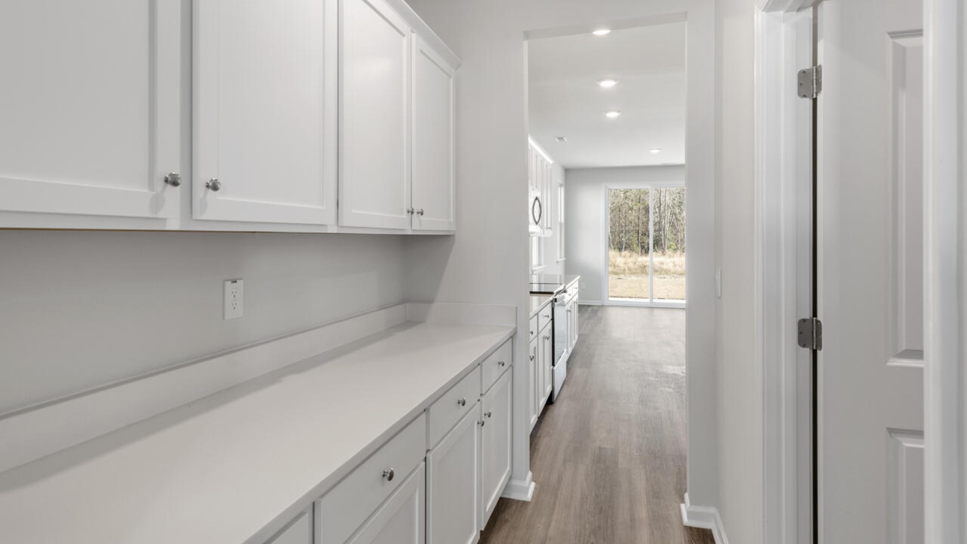 Downstairs there is a formal dining room that leads into a large butler's pantry then the kitchen. The kitchen is loaded with features including a granite island, 36'' cabinets, tile backsplash, stainless-steel appliances and opens up to the living room.
