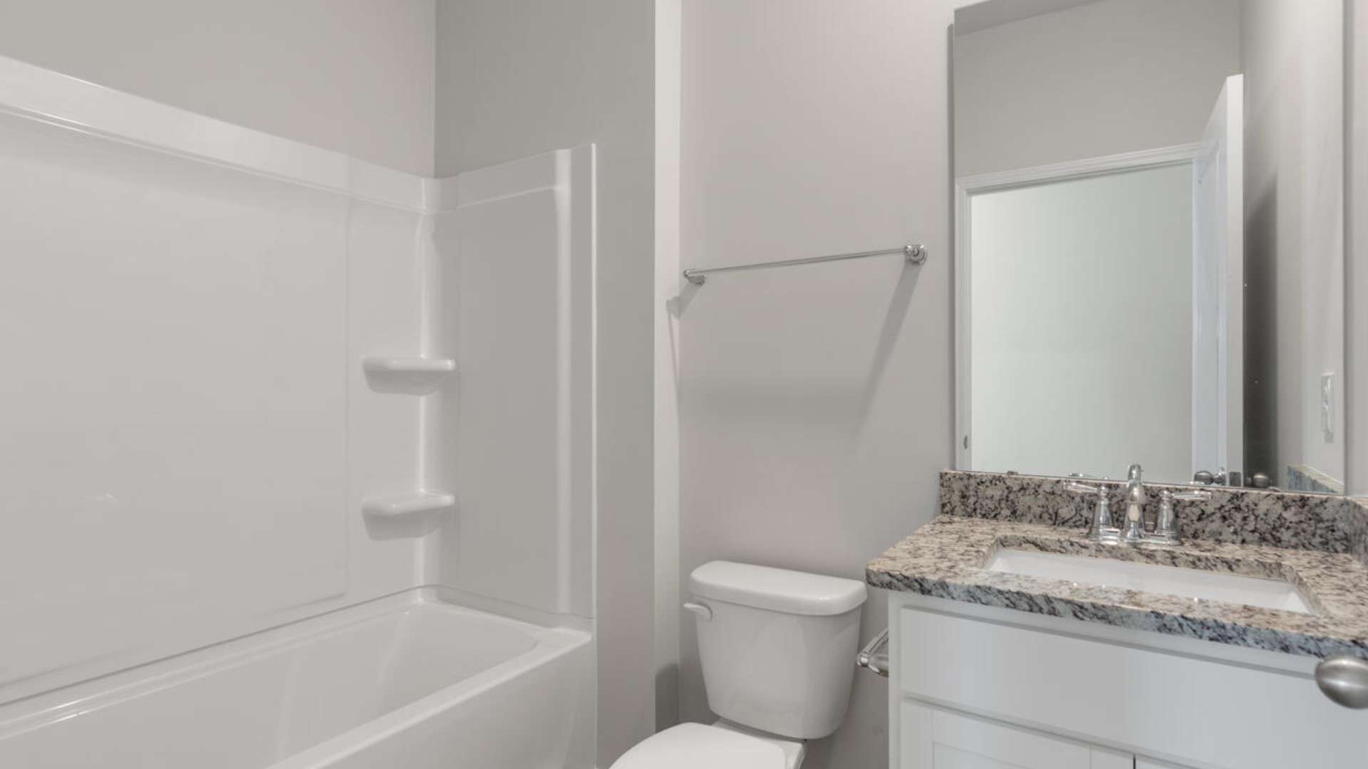 Downstairs there is a formal dining room that leads into a large butler's pantry then the kitchen. The kitchen is loaded with features including a granite island, 36'' cabinets, tile backsplash, stainless-steel appliances and opens up to the living room