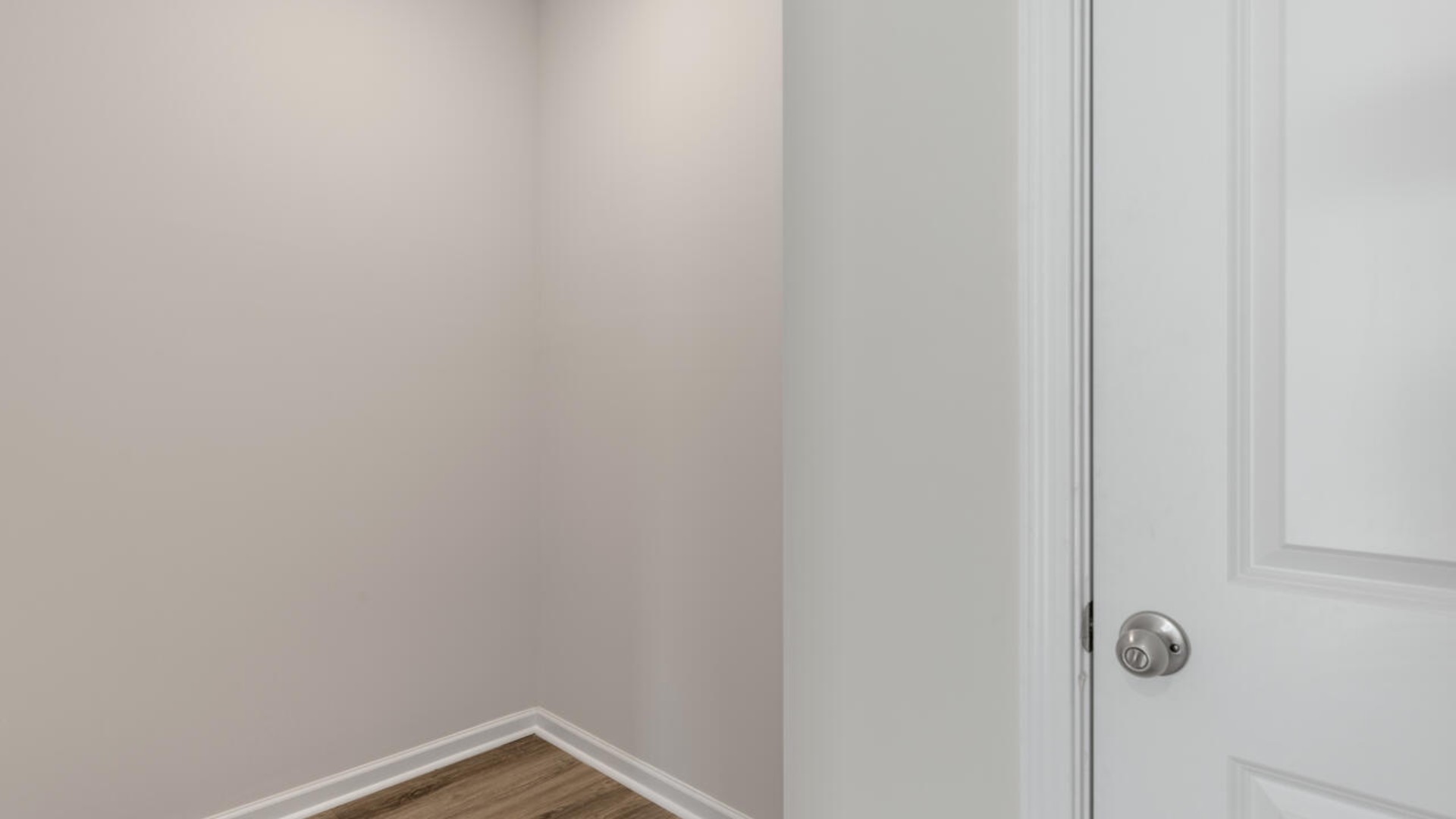 Downstairs there is a formal dining room that leads into a large butler's pantry then the kitchen. The kitchen is loaded with features including a granite island, 36'' cabinets, tile backsplash, stainless-steel appliances and opens up to the living room