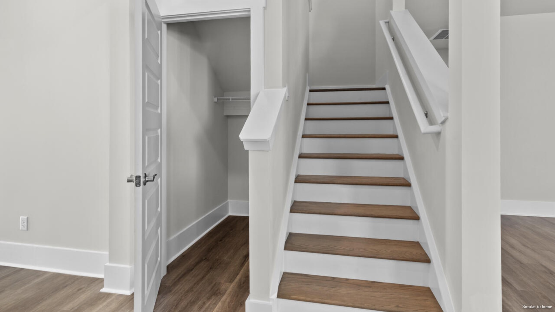 Upstairs you are greeted by a convenient loft, a laundry room, and the primary retreat, which boasts the suite's sitting room and substantial walk-in closet.