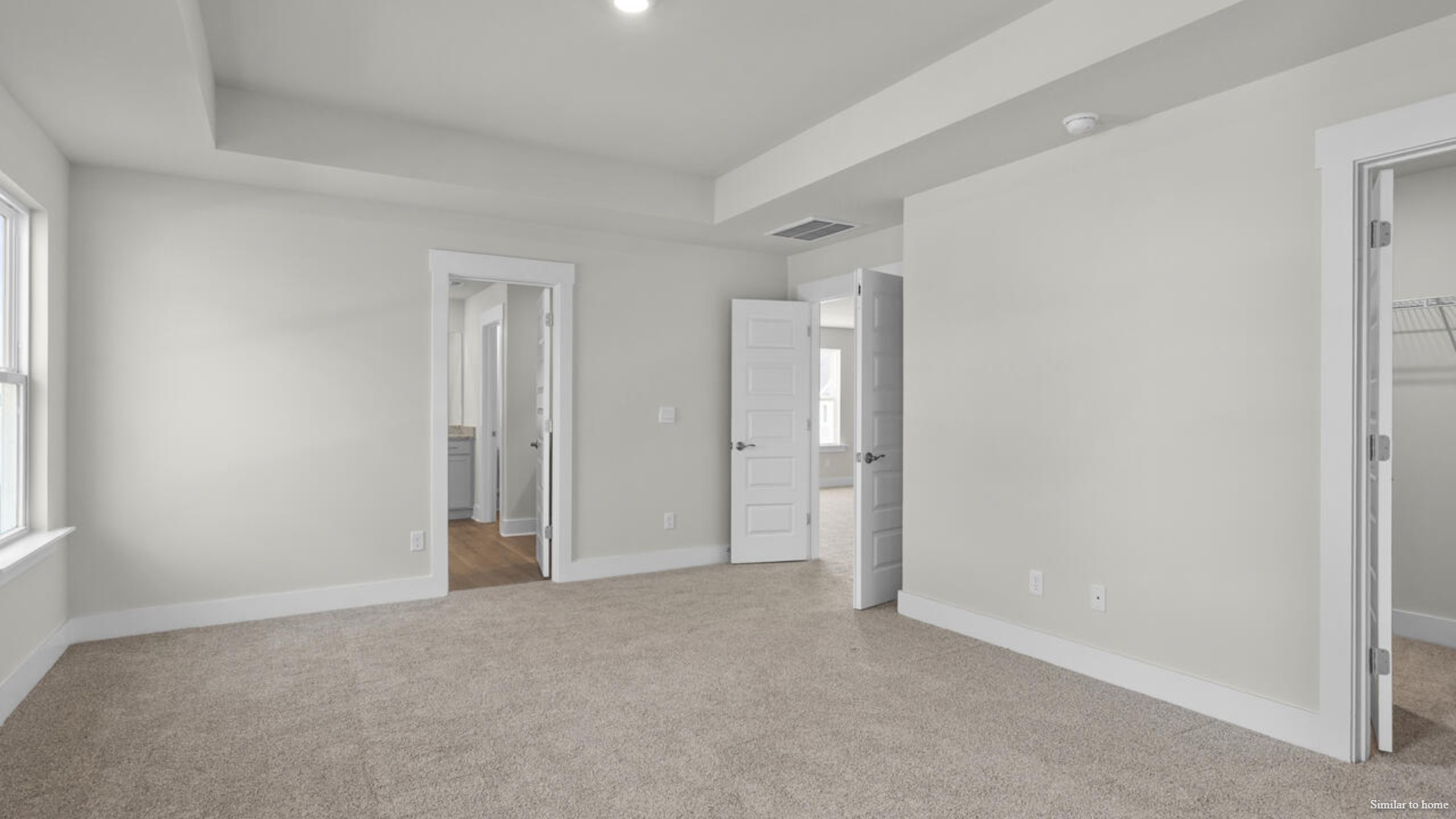 Upstairs you are greeted by a convenient loft, a laundry room, and the primary retreat, which boasts the suite's sitting room and substantial walk-in closet.