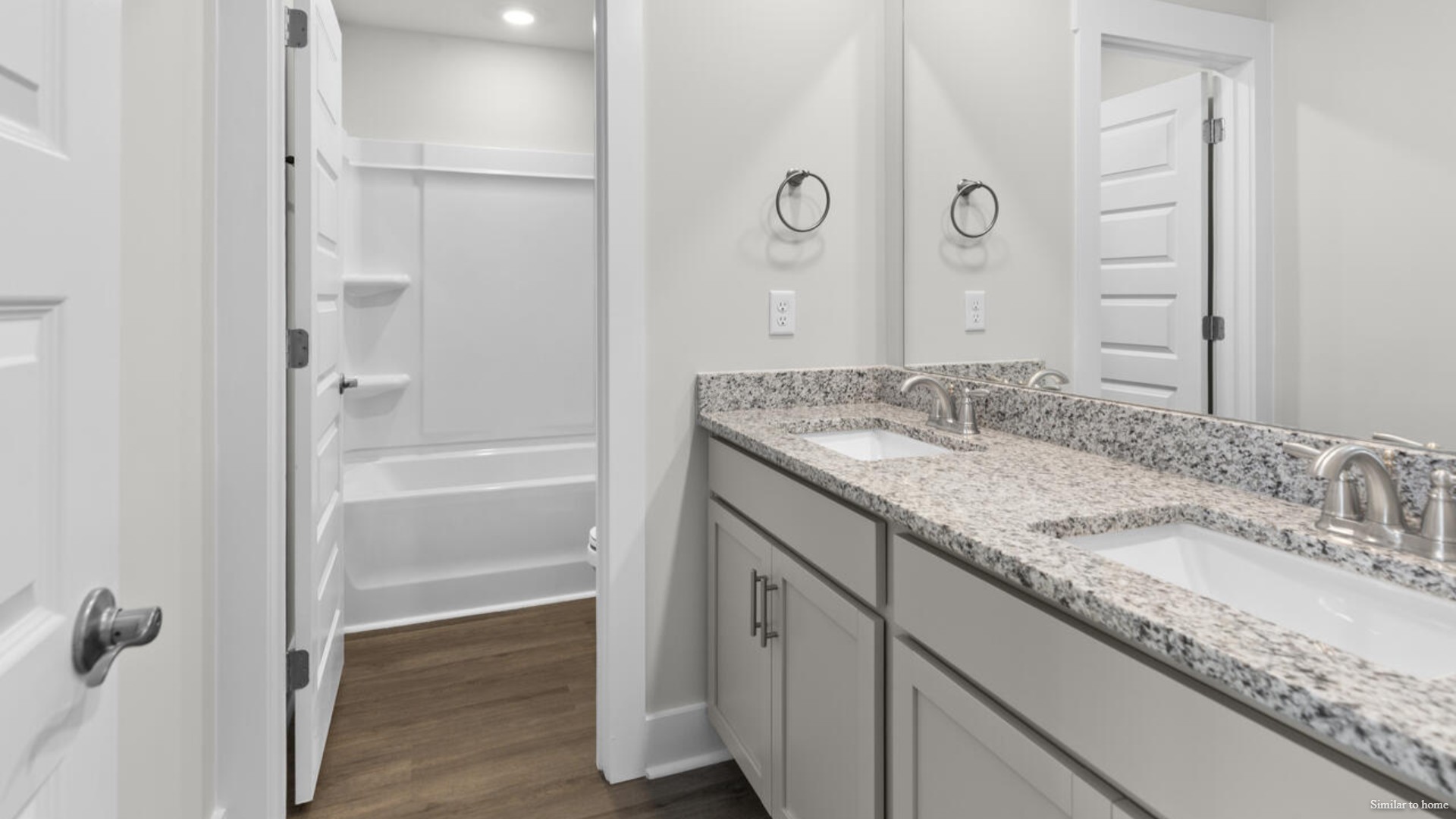 Upstairs you are greeted by a convenient loft, a laundry room, and the primary retreat, which boasts the suite's sitting room and substantial walk-in closet.