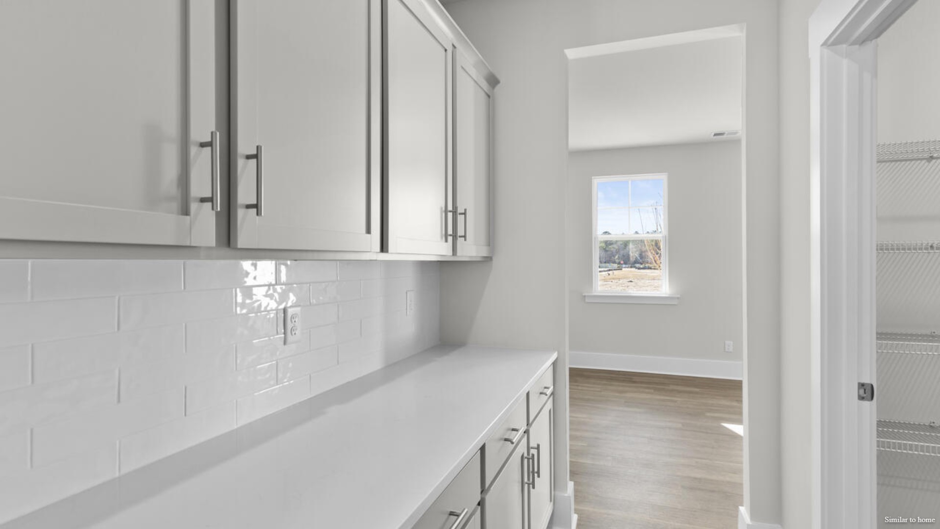 Downstairs there is a formal dining room that leads into a large butler's pantry then the kitchen. The kitchen is loaded with features including a quartz island, 36'' cabinets, stainless-steel appliances and opens up to the living room.