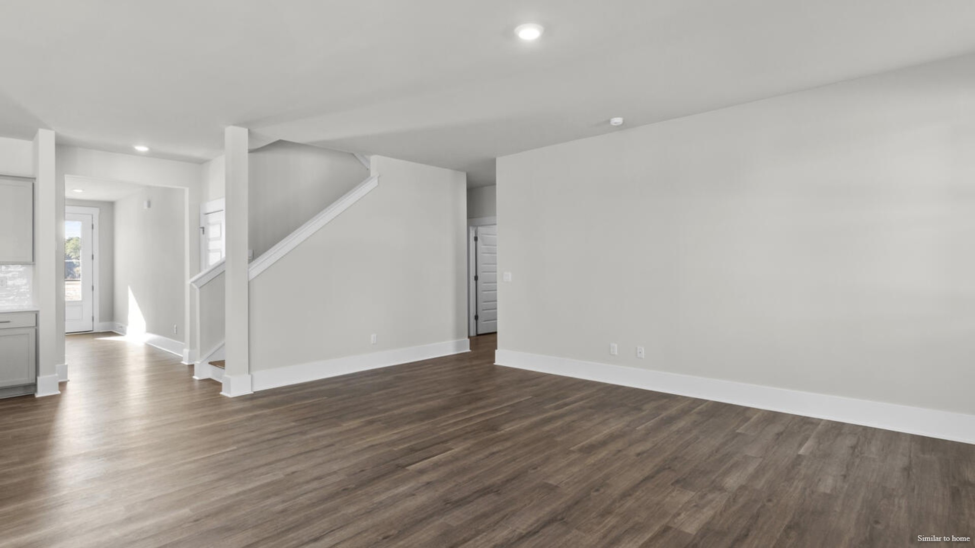 Downstairs there is a formal dining room that leads into a large butler's pantry then the kitchen. The kitchen is loaded with features including a quartz island, 36'' cabinets, stainless-steel appliances and opens up to the living room.