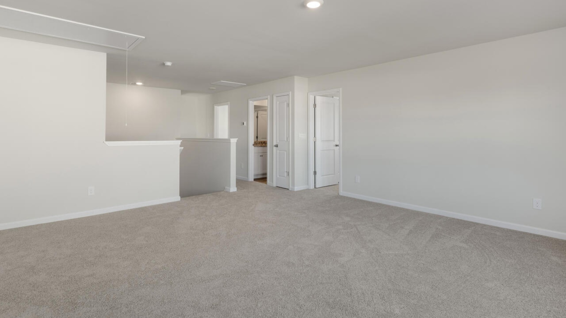 Large upstairs loft with closets for storage. Upstairs you are greeted by a convenient loft, a laundry room