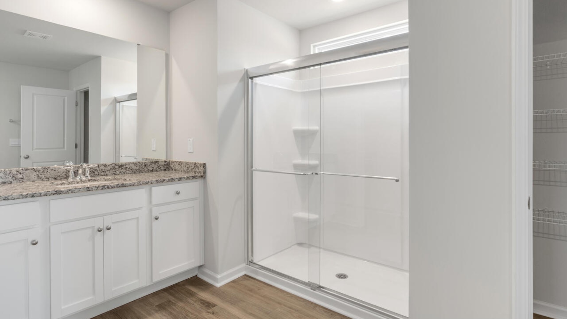 Upstairs you are greeted by a convenient loft, a laundry room, and the primary retreat, which boasts the suite's sitting room and substantial walk-in closet.