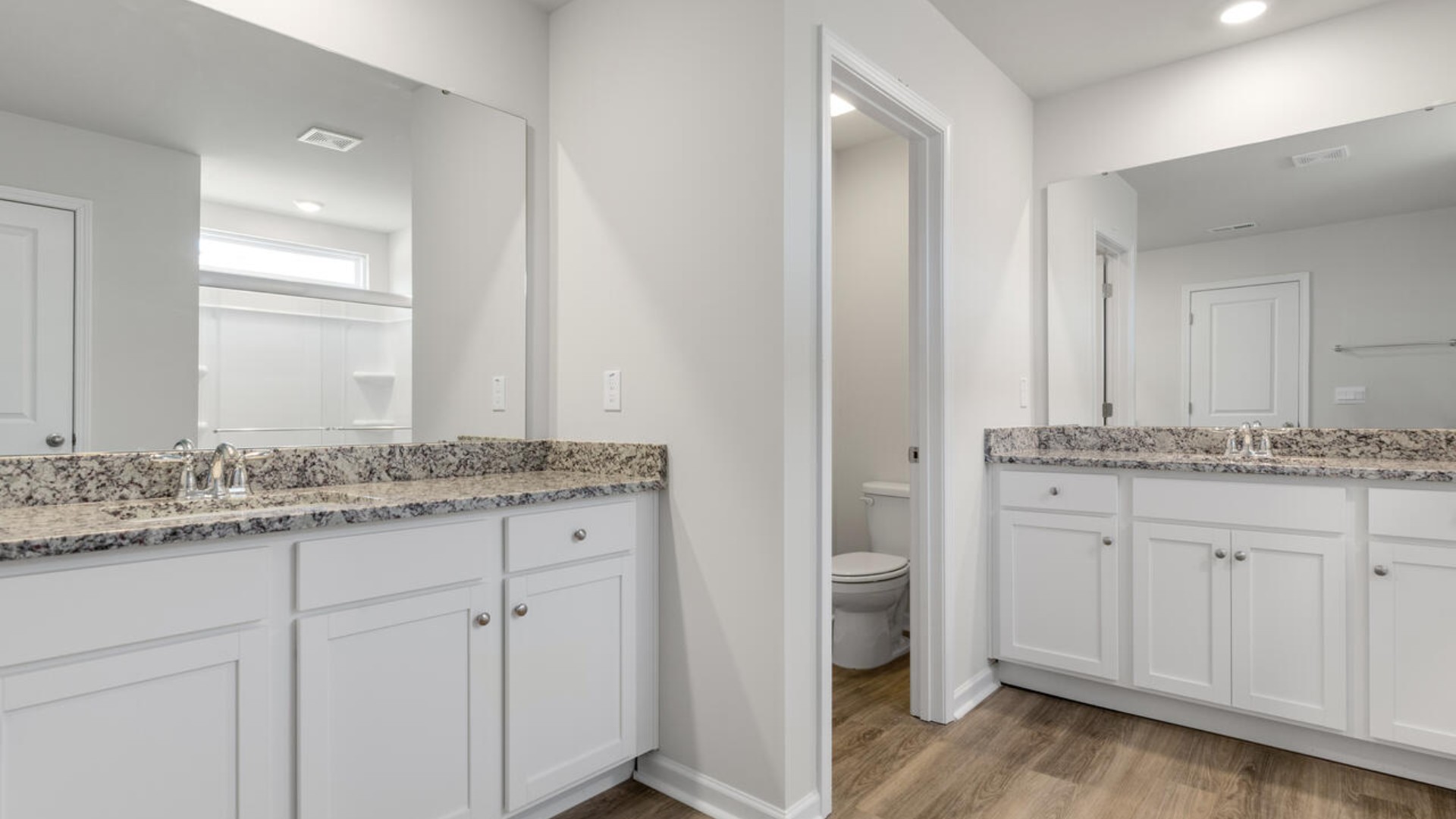 Upstairs you are greeted by a convenient loft, a laundry room, and the primary retreat, which boasts the suite's sitting room and substantial walk-in closet.