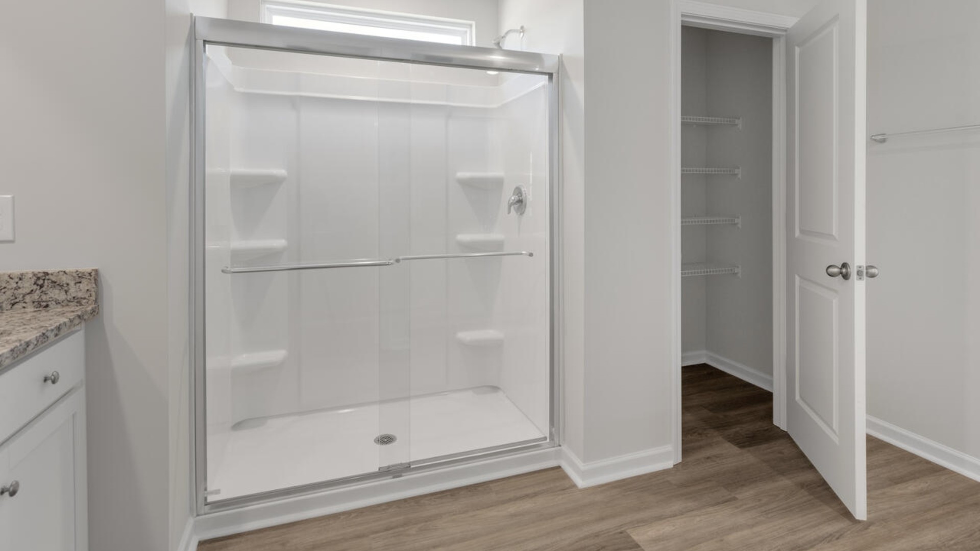 Upstairs you are greeted by a convenient loft, a laundry room, and the primary retreat, which boasts the suite's sitting room and substantial walk-in closet.