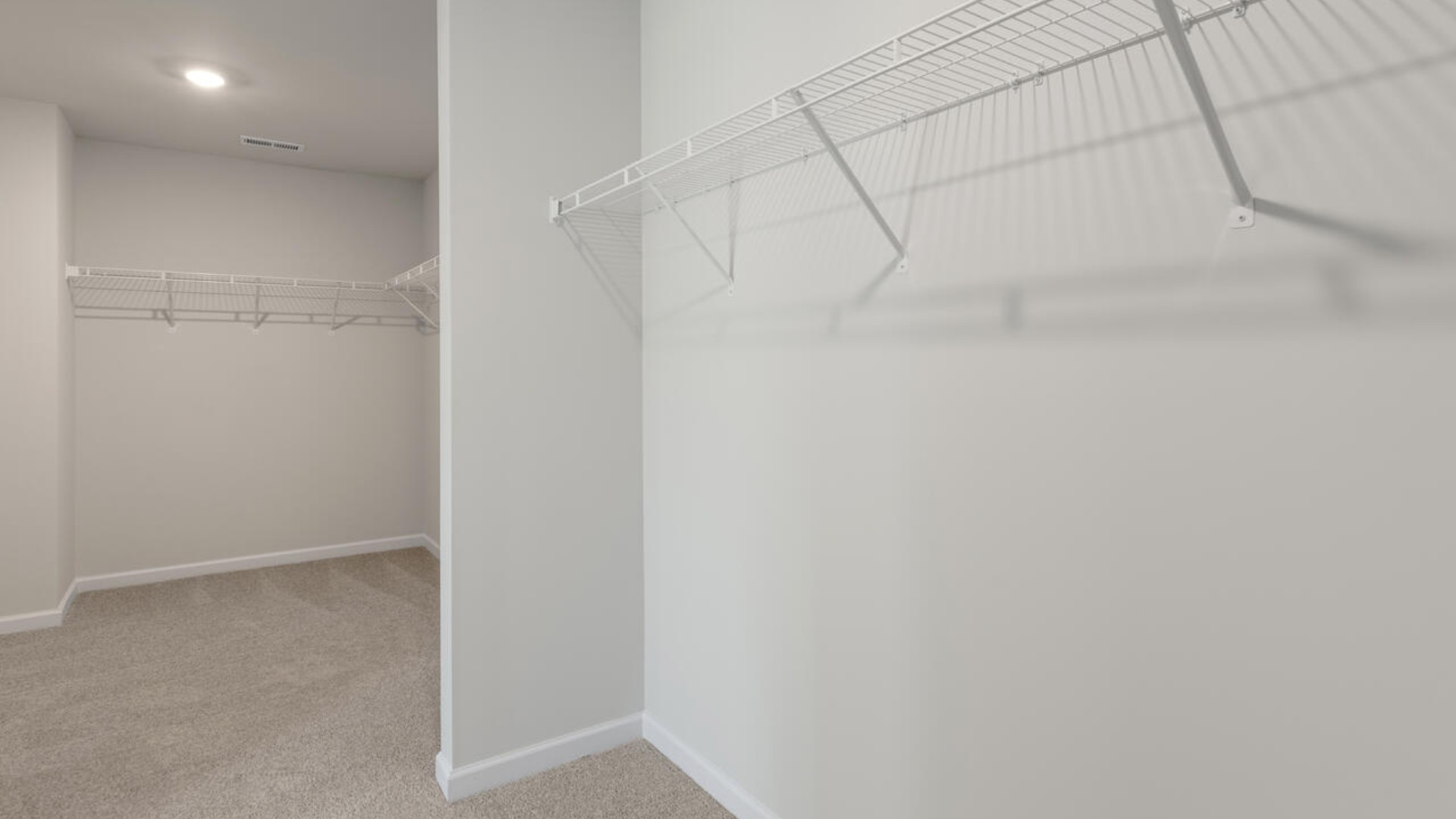 Upstairs you are greeted by a convenient loft, a laundry room, and the primary retreat, which boasts the suite's sitting room and substantial walk-in closet.