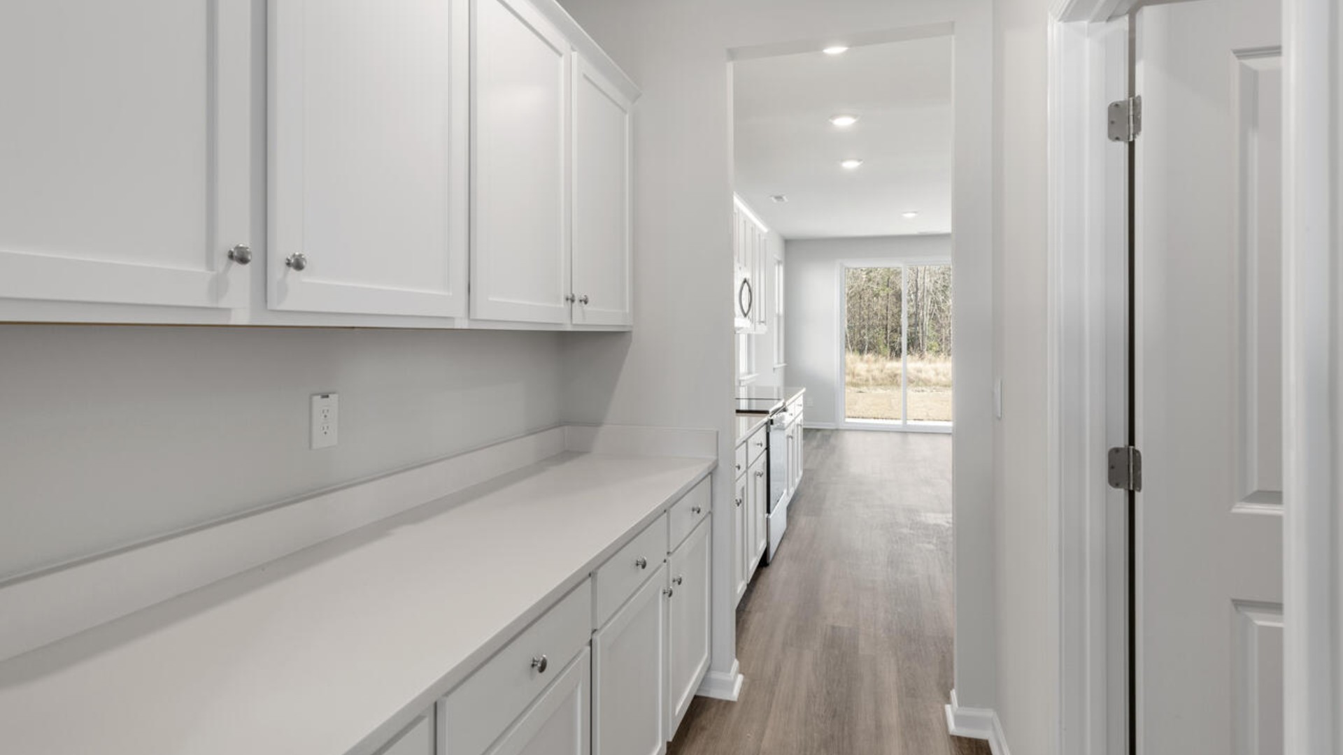 The kitchen is loaded with features including a granite island, 36'' cabinets, stainless-steel appliances and opens up to the living room.