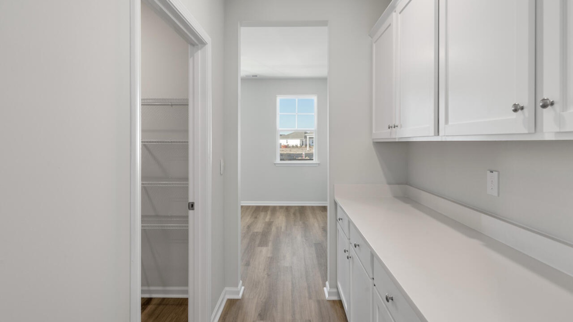 The kitchen is loaded with features including a granite island, 36'' cabinets, stainless-steel appliances and opens up to the living room.