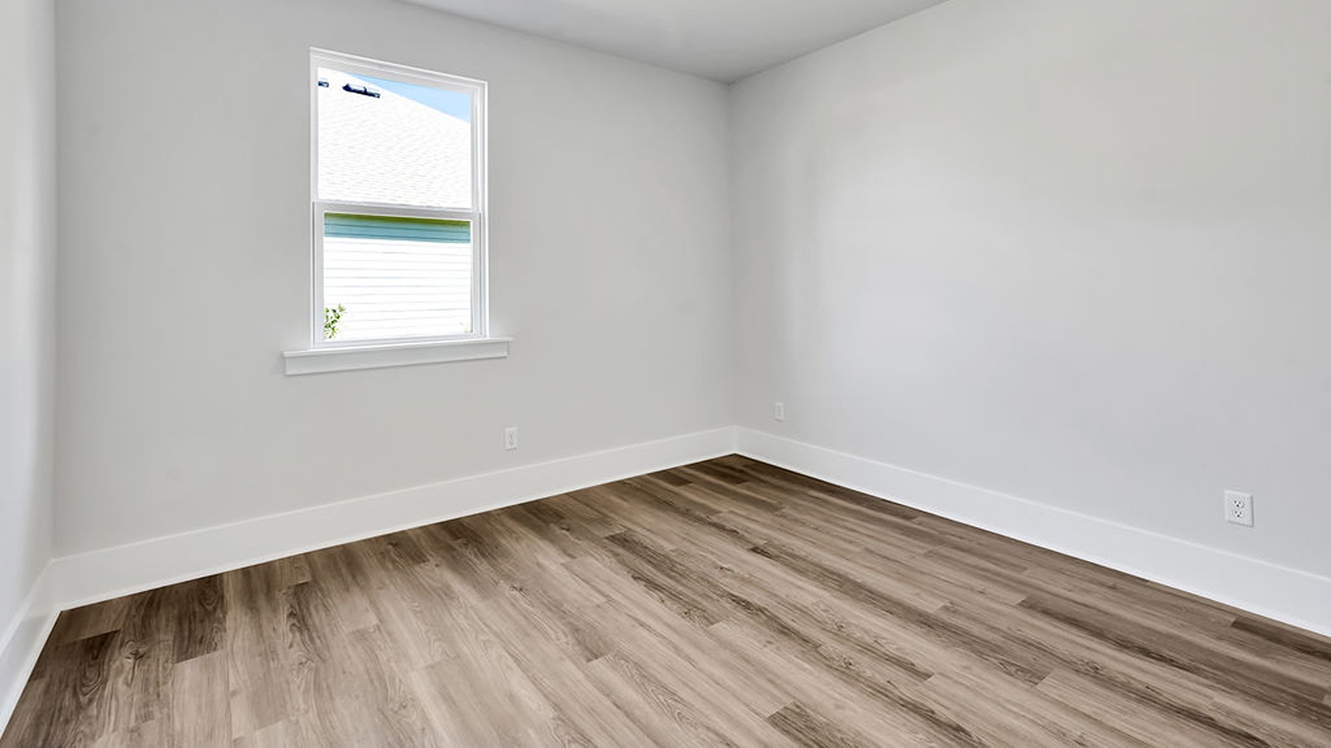 The main level also uniquely includes a private secondary bedroom away from the traffic, making it an ideal guest suite or quiet home office, conveniently adjacent to a full secondary bathroom and a nearby powder room.