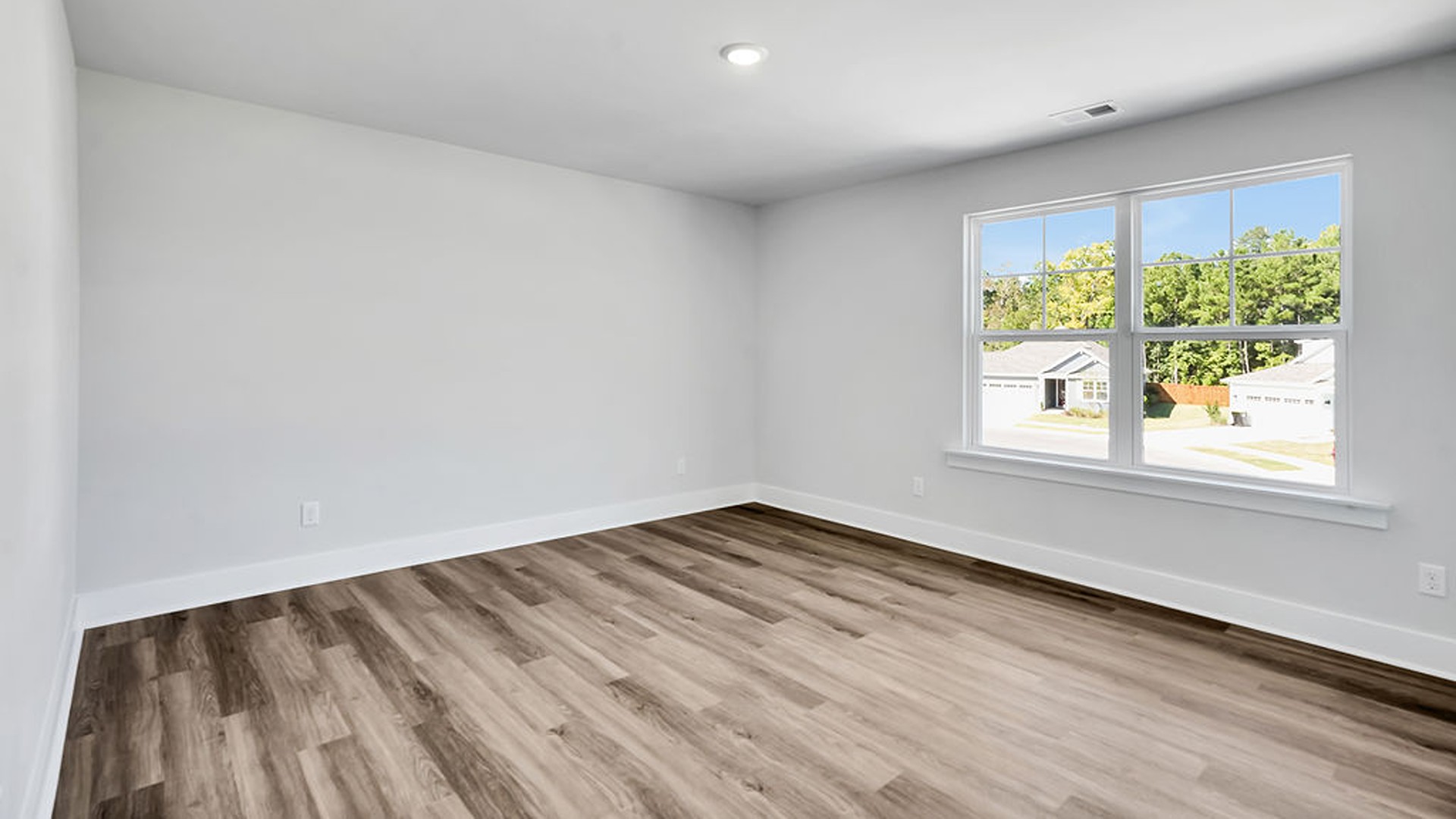Upstairs, the crown jewel is the massive Primary Bedroom, a true owner’s getaway featuring tray ceiling details, abundant natural light, a spa-inspired bath with double vanities, and an oversized Walk-In Closet with integrated attic access.
