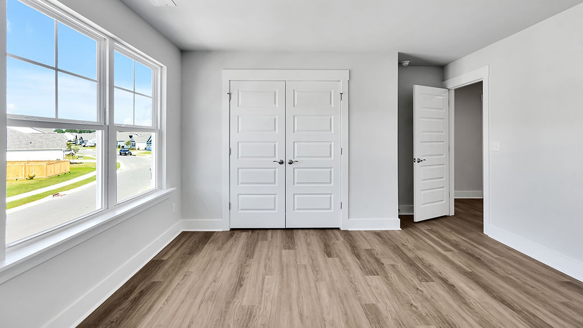Upstairs, the crown jewel is the massive Primary Bedroom, a true owner’s getaway featuring tray ceiling details, abundant natural light, a spa-inspired bath with double vanities, and an oversized Walk-In Closet with integrated attic access.