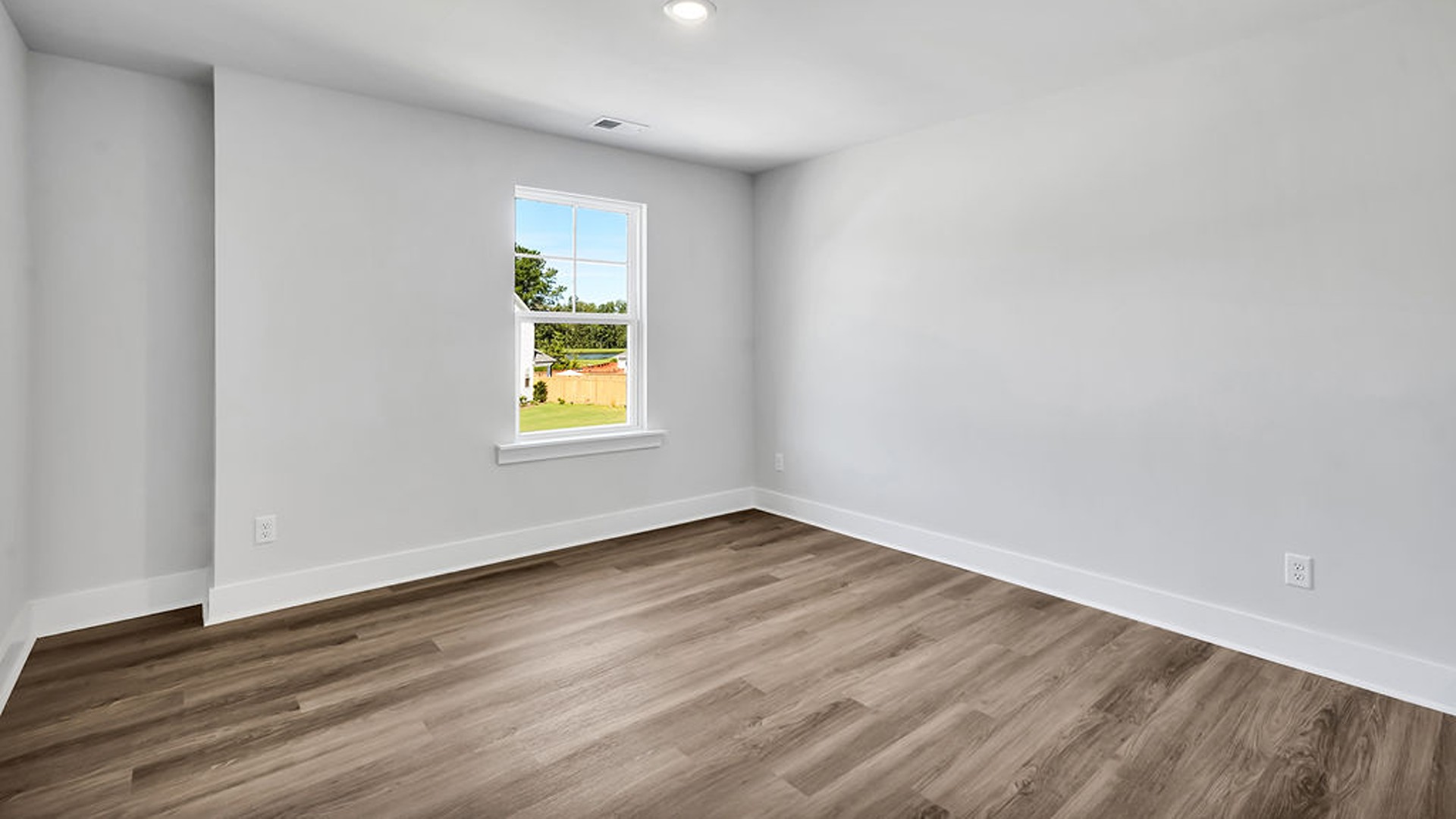 Upstairs, the crown jewel is the massive Primary Bedroom, a true owner’s getaway featuring tray ceiling details, abundant natural light, a spa-inspired bath with double vanities, and an oversized Walk-In Closet with integrated attic access.