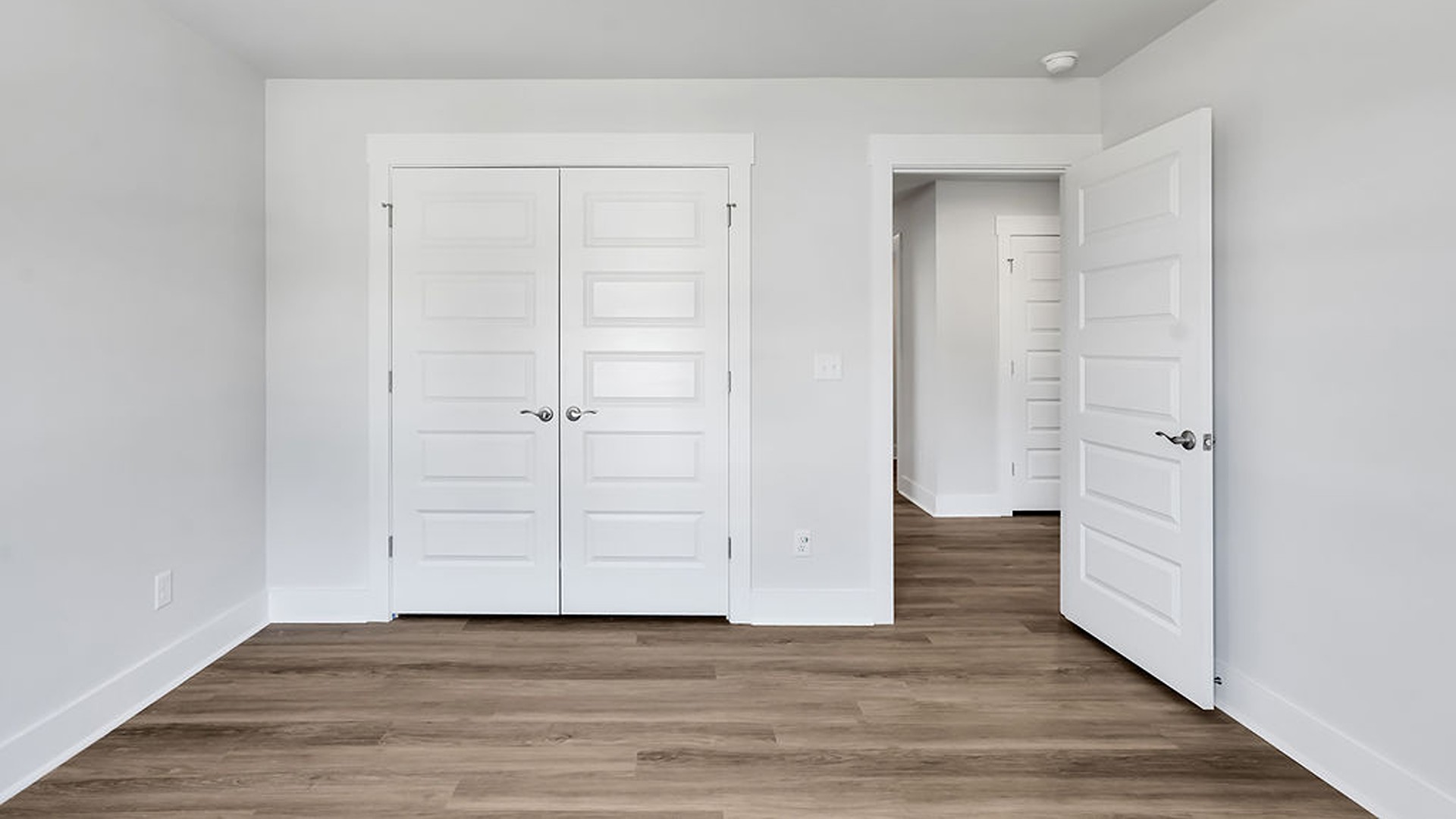 Upstairs, the crown jewel is the massive Primary Bedroom, a true owner’s getaway featuring tray ceiling details, abundant natural light, a spa-inspired bath with double vanities, and an oversized Walk-In Closet with integrated attic access.