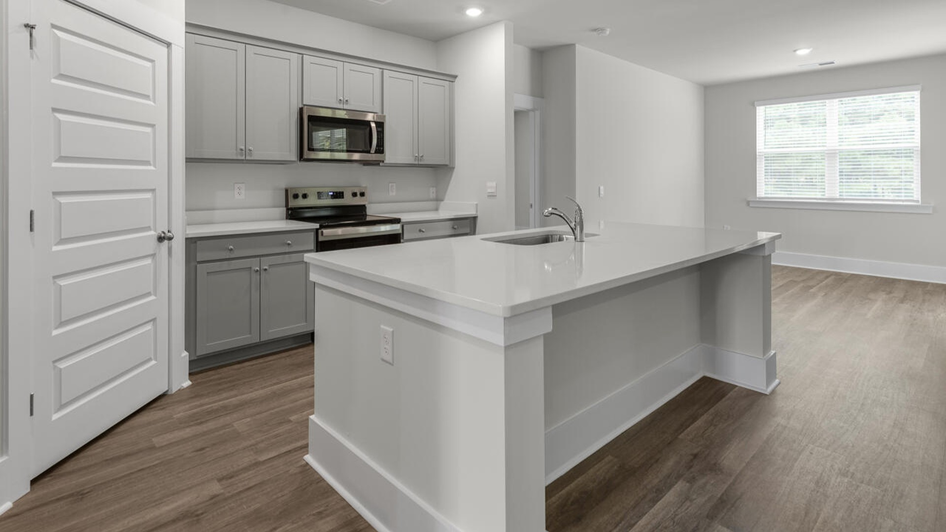 The kitchen comes finished with beautiful granite countertops, stainless steel appliances, single-bowl sink and tile backsplash.