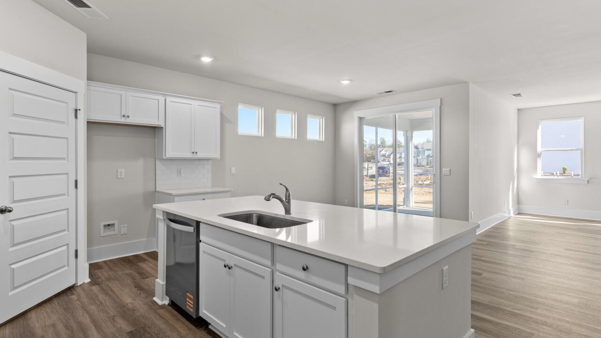 This open concept home features 9 ft. ceilings, granite kitchen counter tops, walk-in pantry, over-sized kitchen island, ample storage space, and granite countertops in the bathrooms.