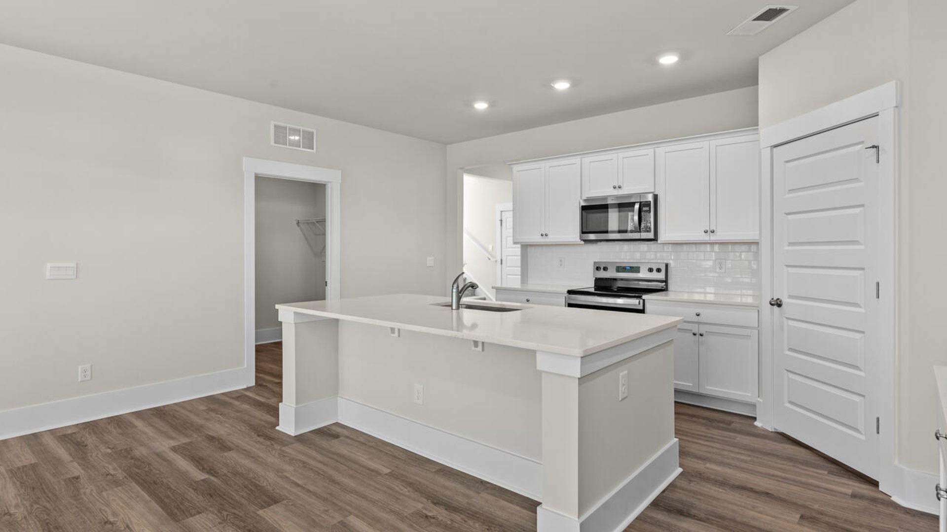 This open concept home features 9 ft. ceilings, granite kitchen counter tops, walk-in pantry, over-sized kitchen island, ample storage space, and granite countertops in the bathrooms.