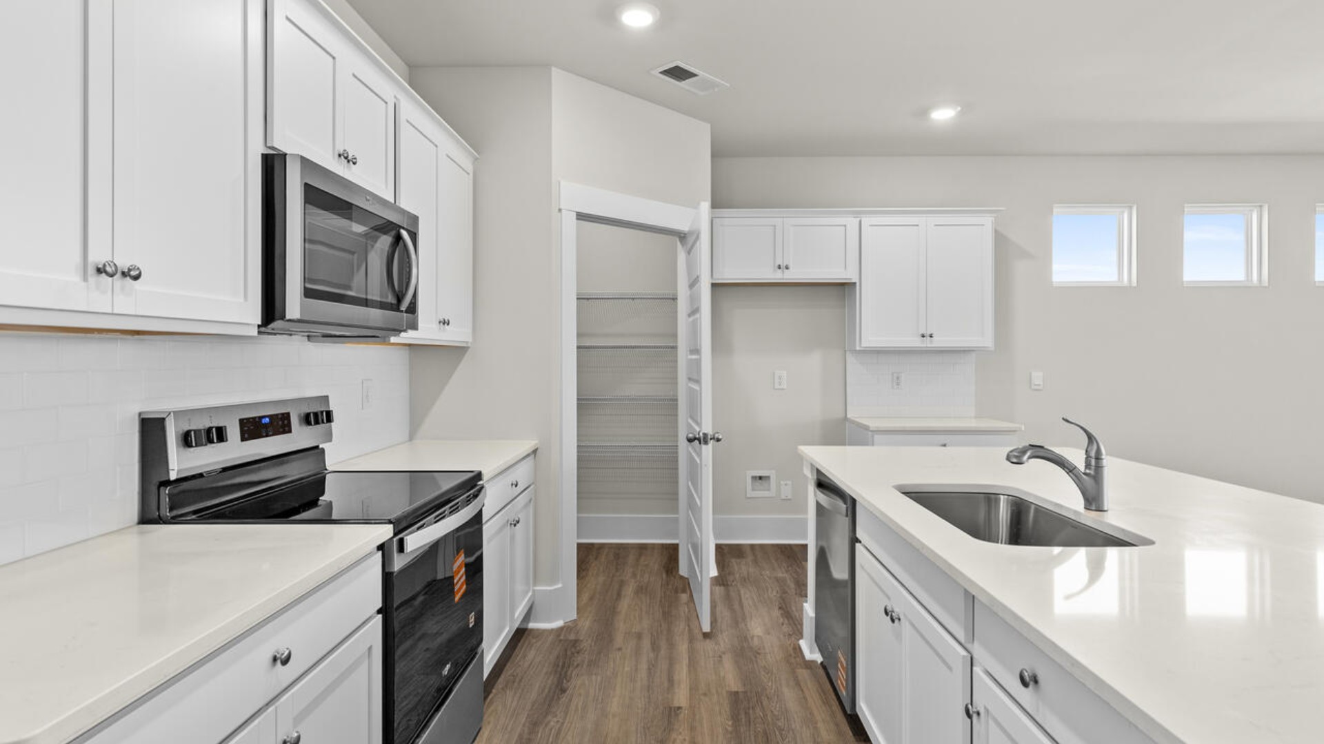 This open concept home features 9 ft. ceilings, granite kitchen counter tops, walk-in pantry, over-sized kitchen island, ample storage space, and granite countertops in the bathrooms.