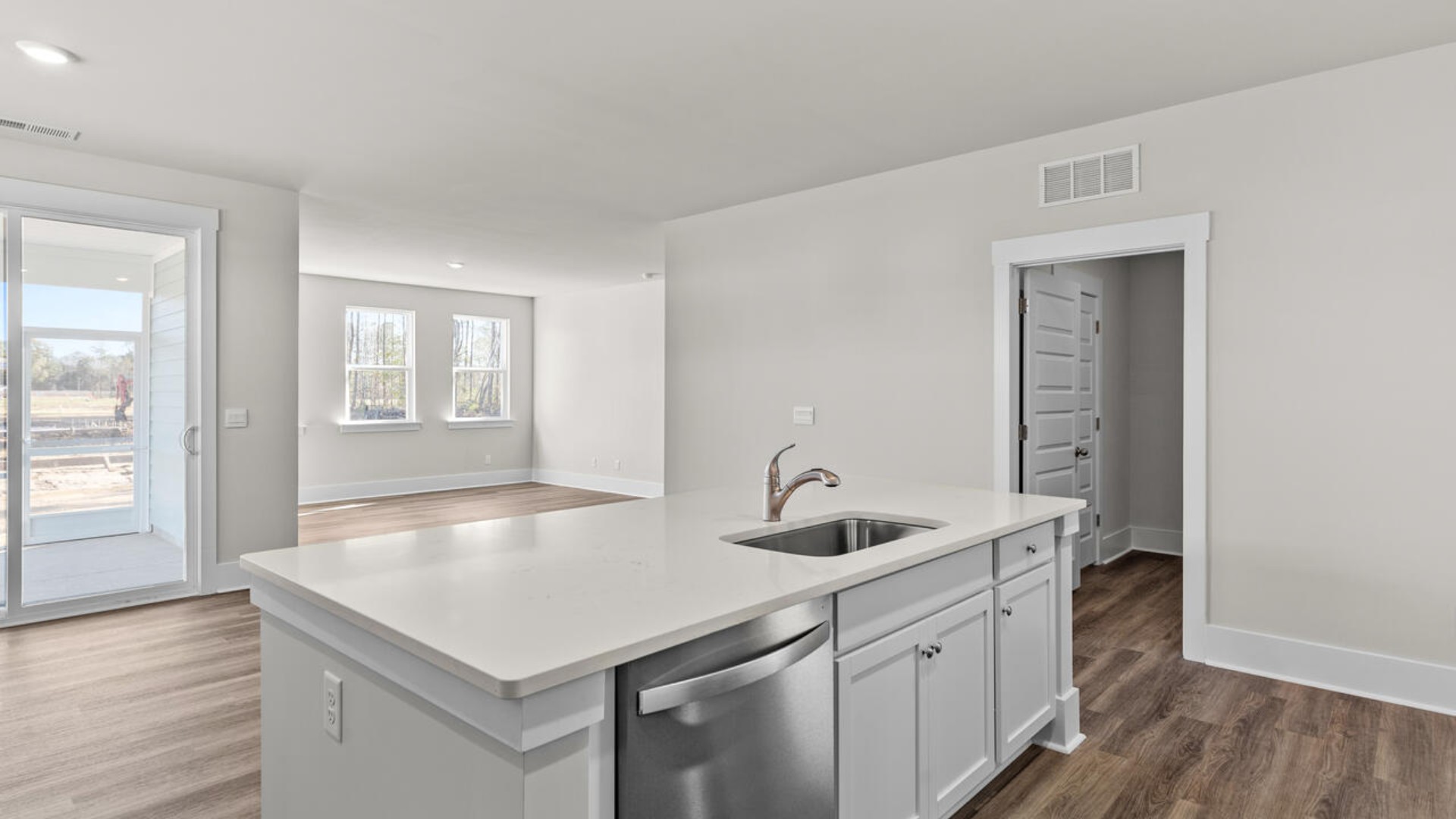 This open concept home features 9 ft. ceilings, granite kitchen counter tops, walk-in pantry, over-sized kitchen island, ample storage space, and granite countertops in the bathrooms.