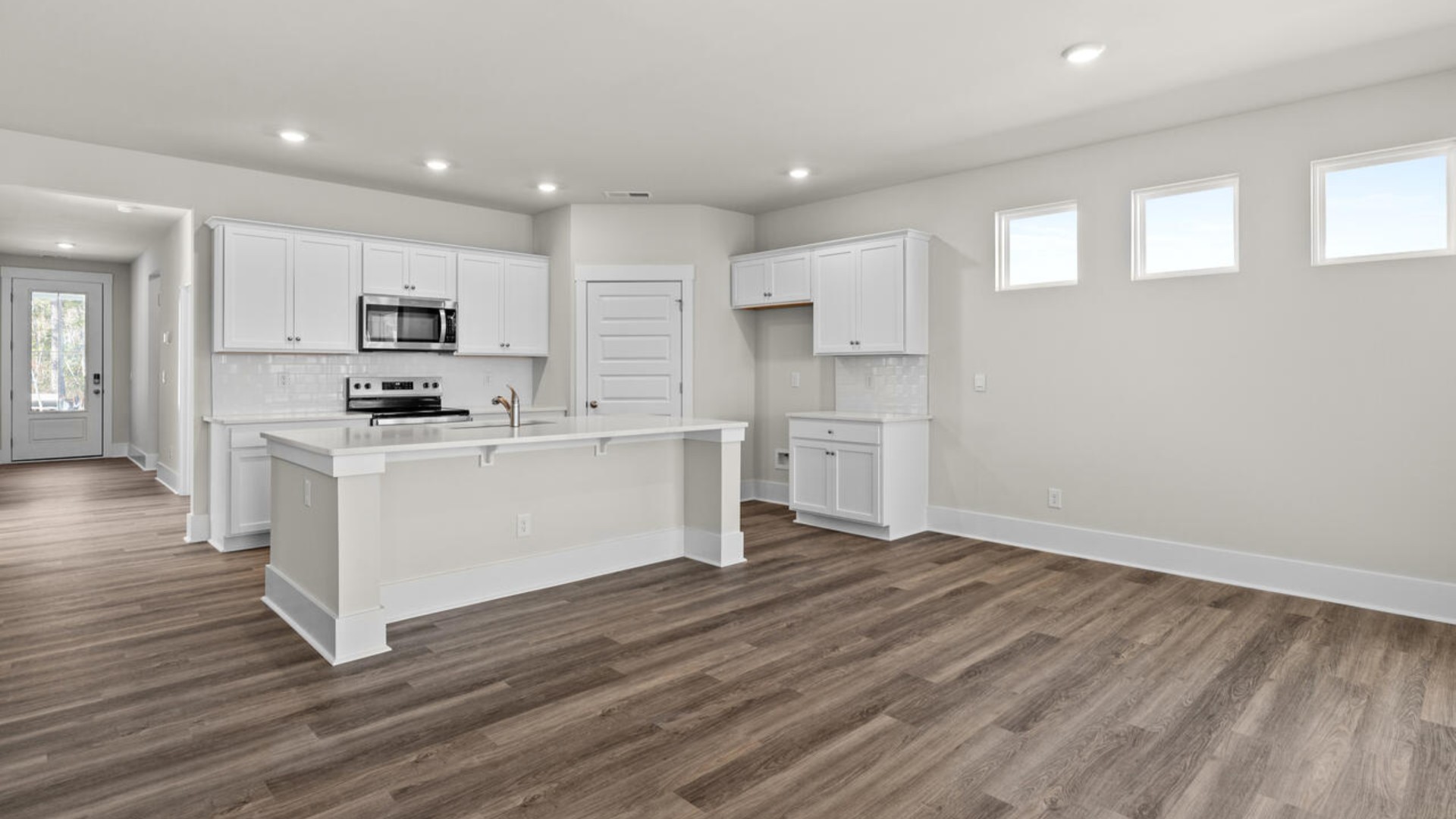 This open concept home features 9 ft. ceilings, granite kitchen counter tops, walk-in pantry, over-sized kitchen island, ample storage space, and granite countertops in the bathrooms.
