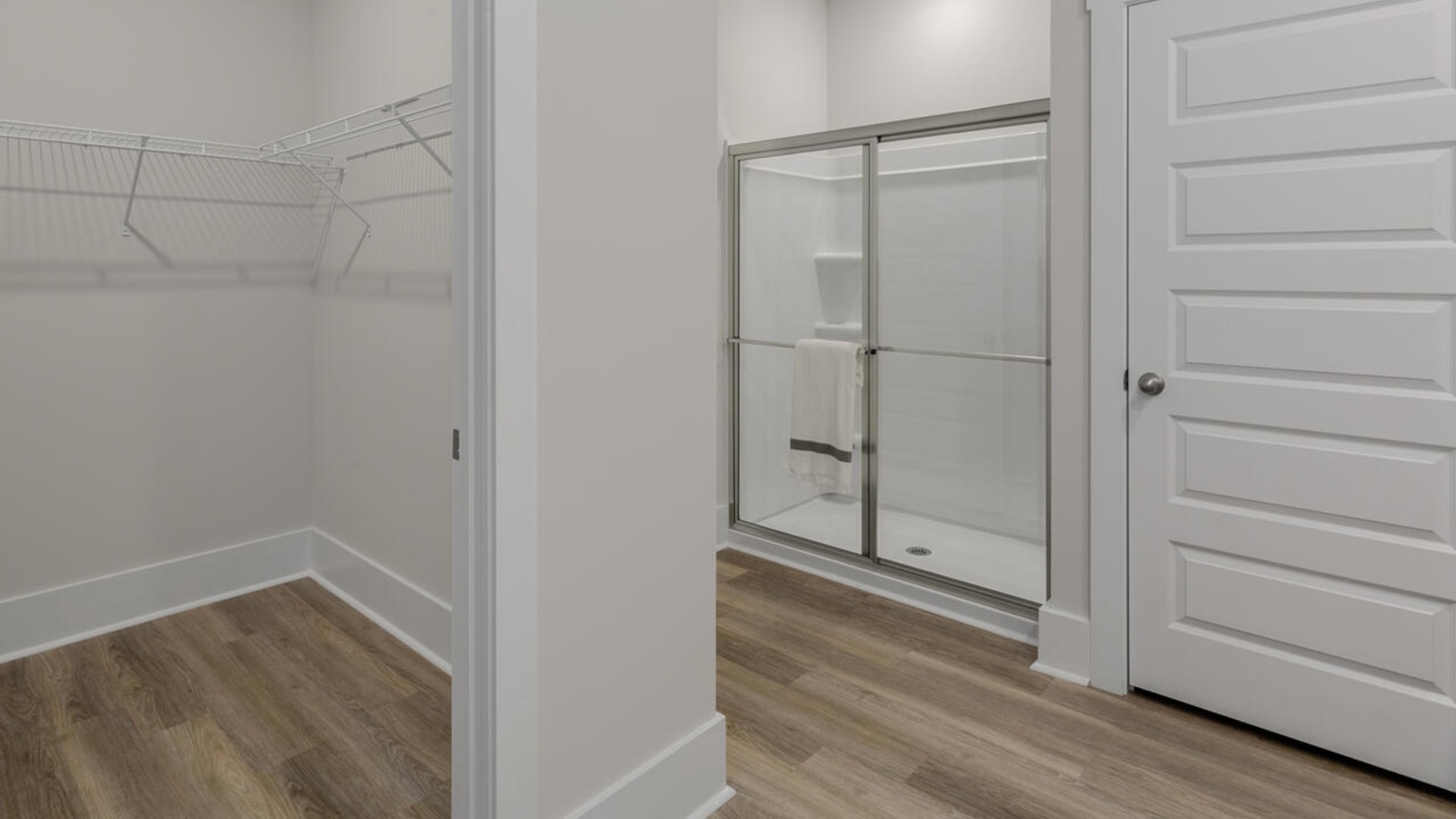 Your primary suite features a 5-foot tiled shower with a frameless glass door and dual vanities for a touch of everyday luxury.