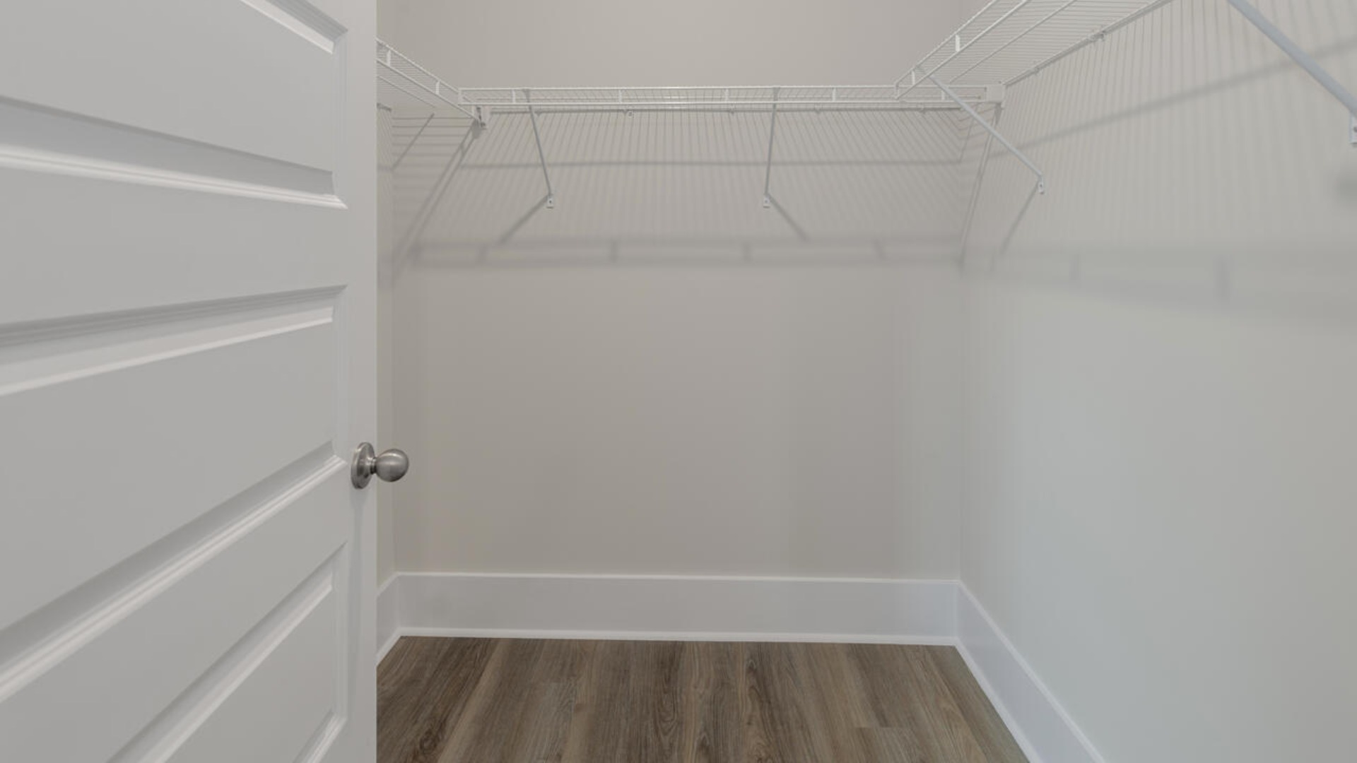 Your primary suite features a 5-foot tiled shower with a frameless glass door and dual vanities for a touch of everyday luxury.