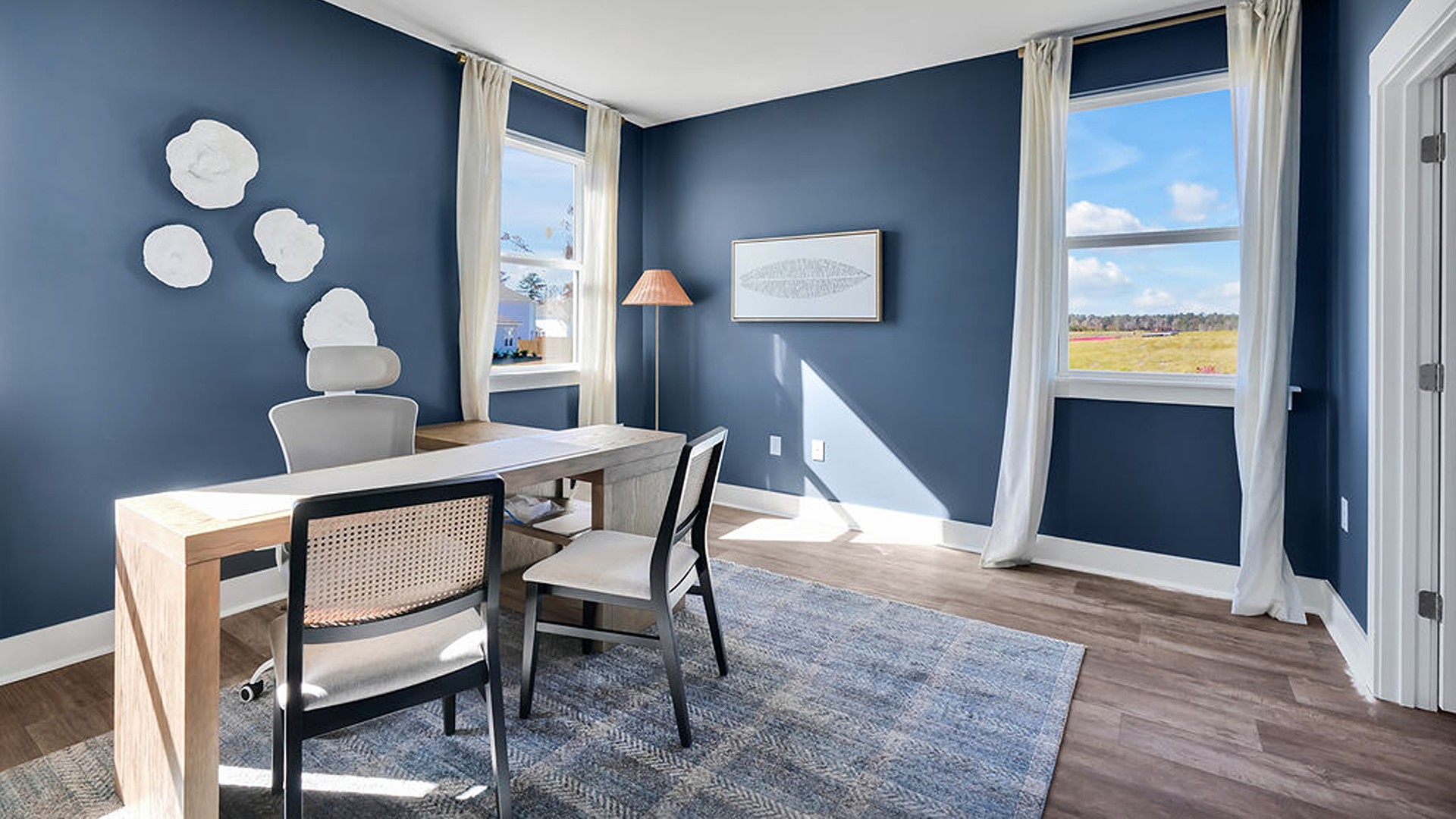 Your primary suite features a 5-foot tiled shower with a frameless glass door and dual vanities for a touch of everyday luxury. This beautiful homesite backs up to a tree line and is on a street that ends in a cul-de-sac.