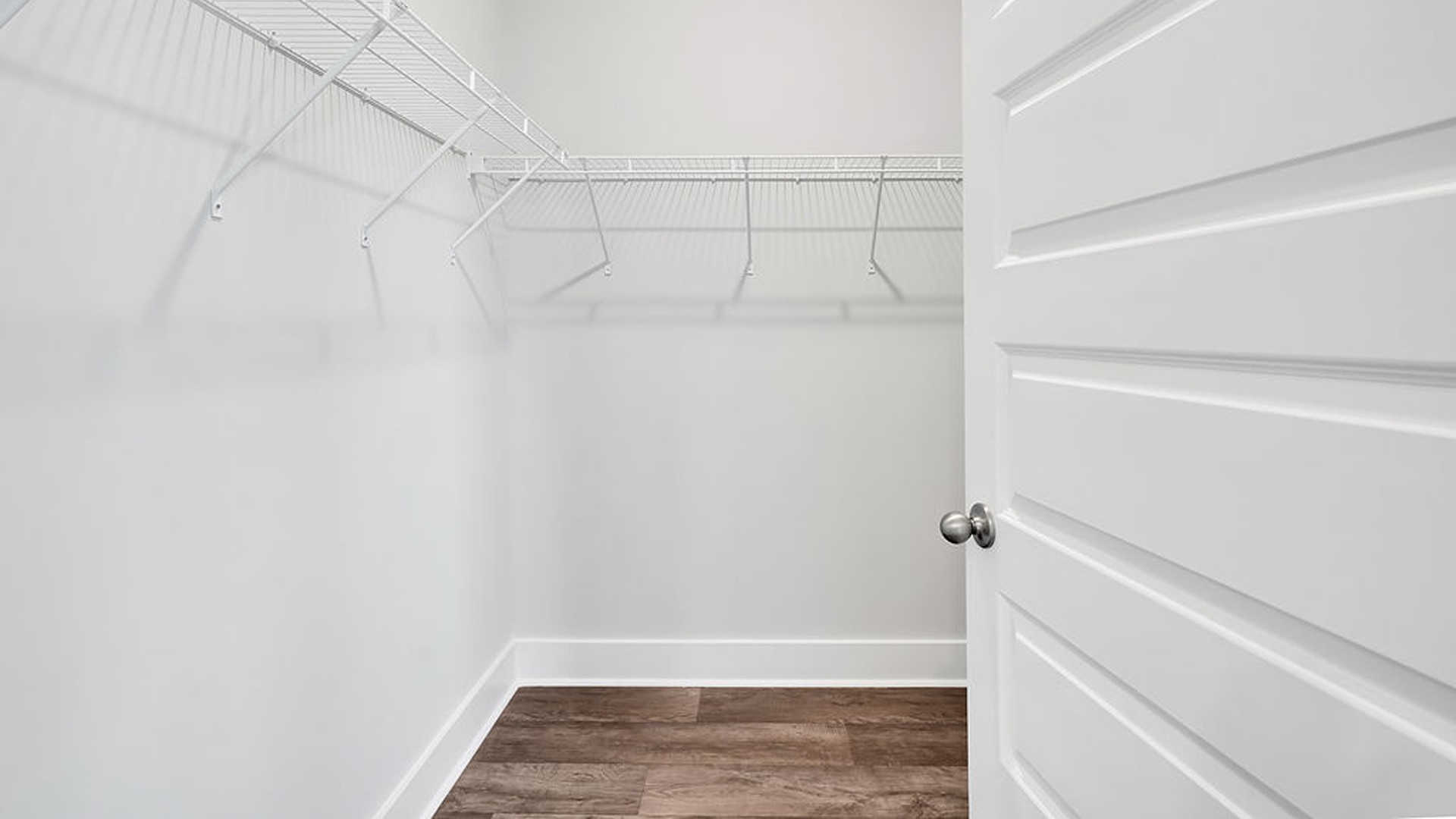 Your primary suite features a 5-foot tiled shower with a frameless glass door and dual vanities for a touch of everyday luxury. This beautiful homesite backs up to a tree line and is on a street that ends in a cul-de-sac.