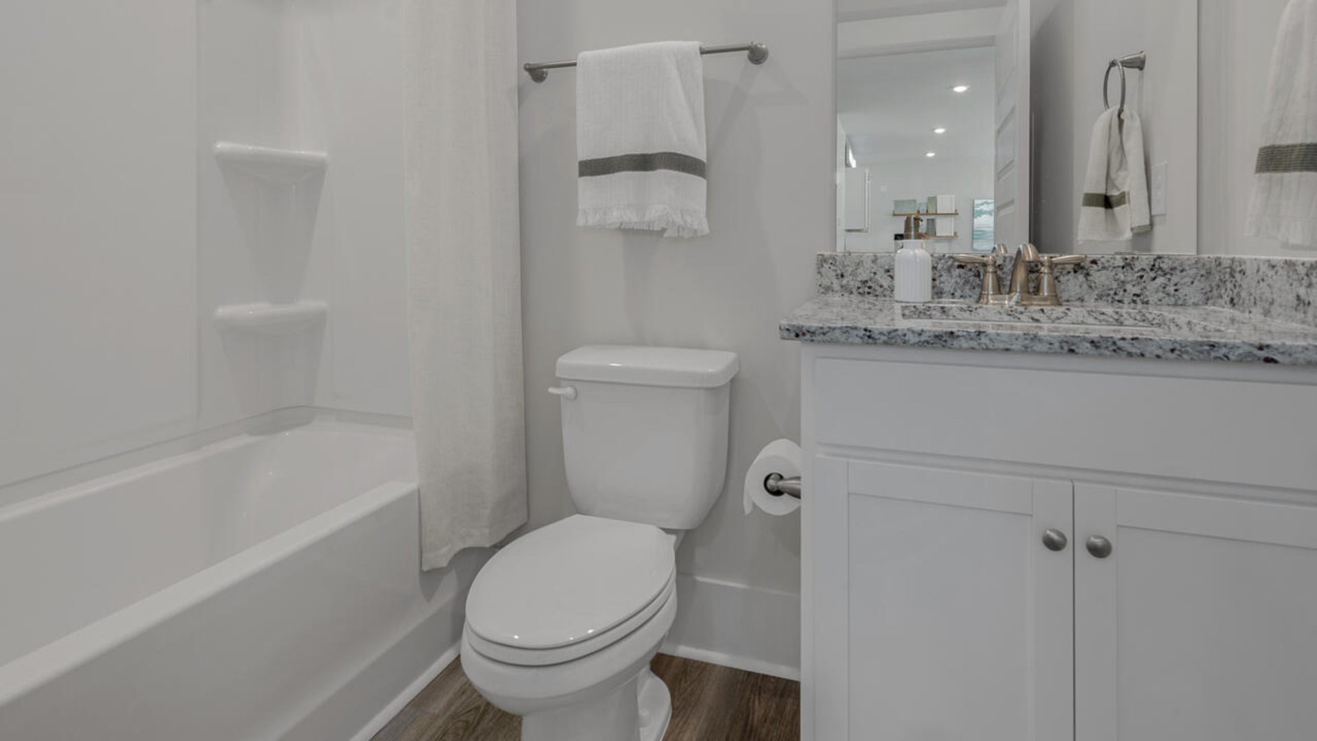 On the first floor you will also find three secondary bedrooms, two full baths, and a three-car garage. Enjoy the covered porch perfect for entertaining and enjoying the Carolina evenings. Ask about our Multi-Gen and 2nd floor options.