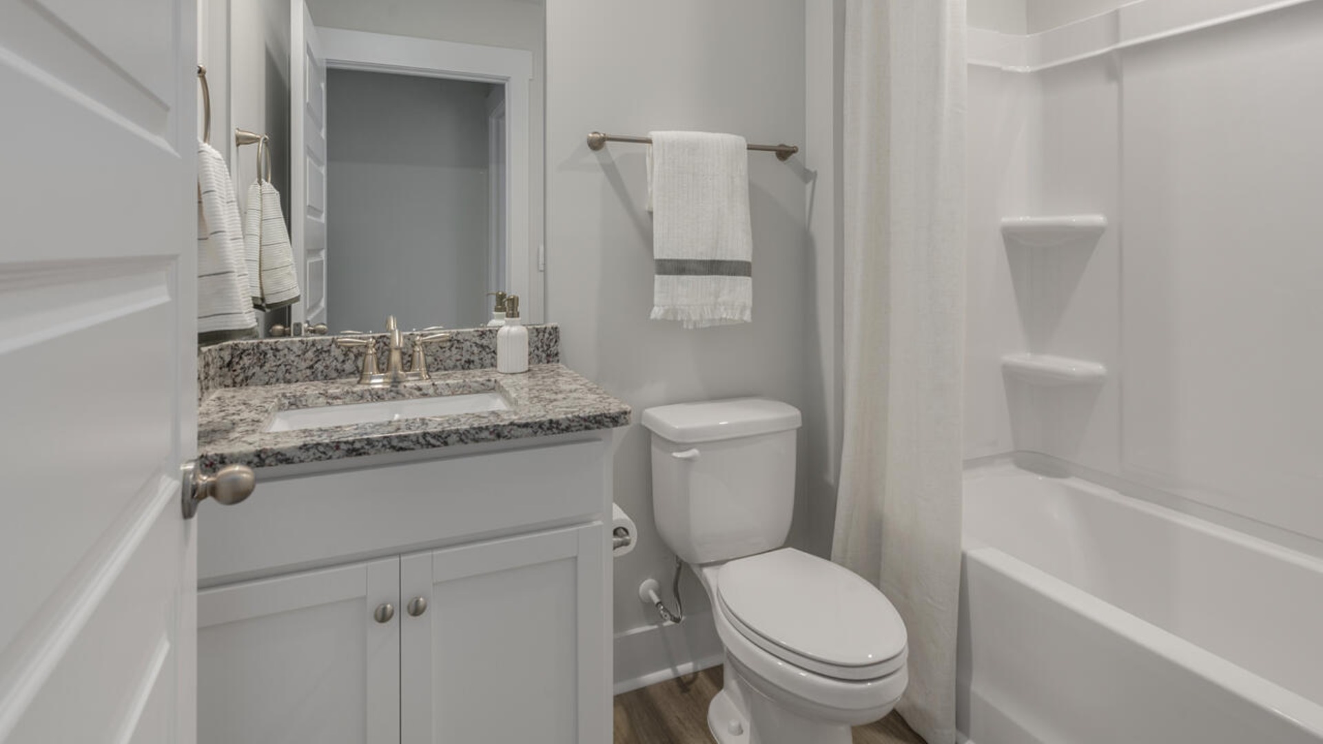 On the first floor you will also find three secondary bedrooms, two full baths, and a three-car garage. Enjoy the covered porch perfect for entertaining and enjoying the Carolina evenings. Ask about our Multi-Gen and 2nd floor options.