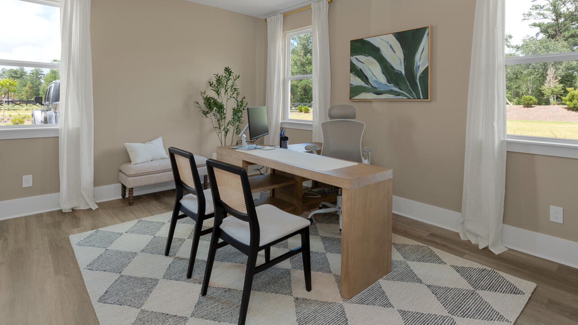 The spacious primary bedroom has a walk-in closet, garden tub, and double bowl vanities