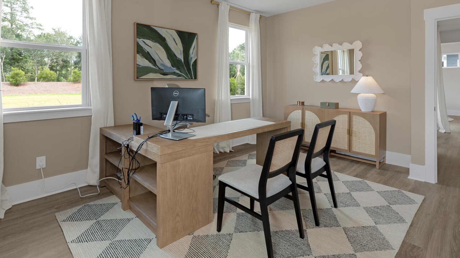 The spacious primary bedroom has a walk-in closet, garden tub, and double bowl vanities