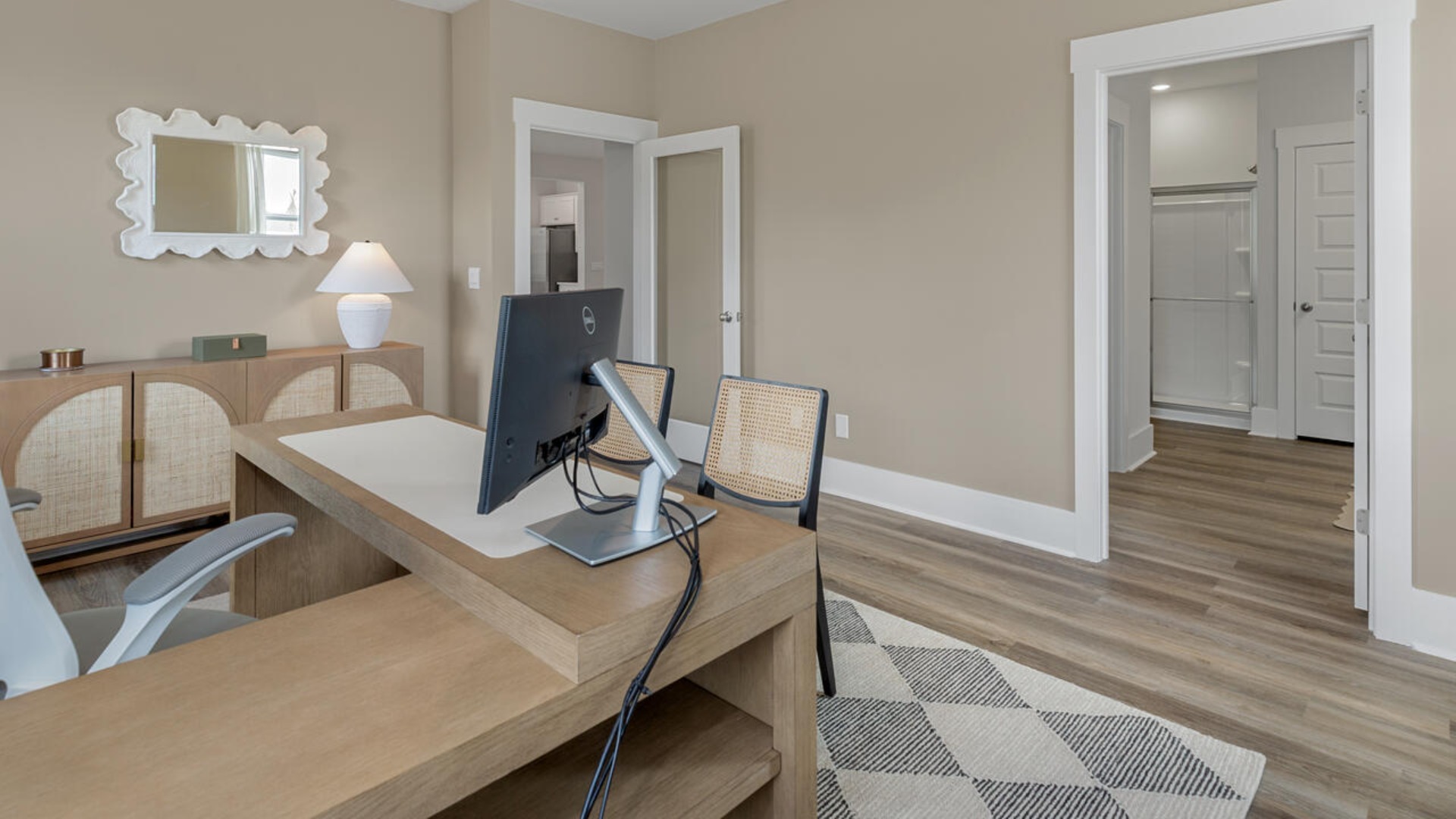 The spacious primary bedroom has a walk-in closet, garden tub, and double bowl vanities