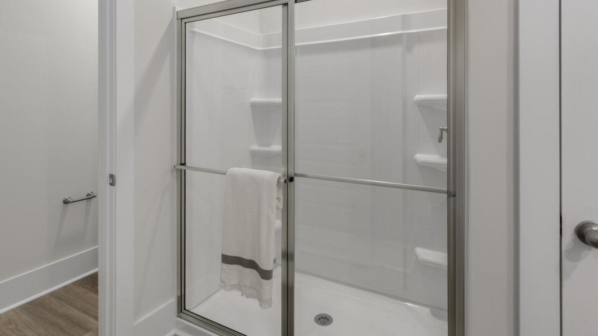 The spacious primary bedroom has a walk-in closet, garden tub, and double bowl vanities