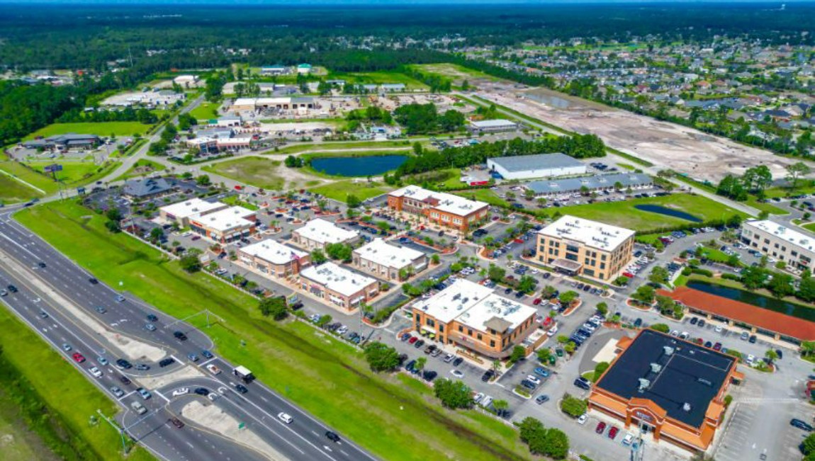 Riverwalk is lined with restaurants, galleries and shops. It runs along the Cape Fear River, where the Battleship North Carolina is moored.