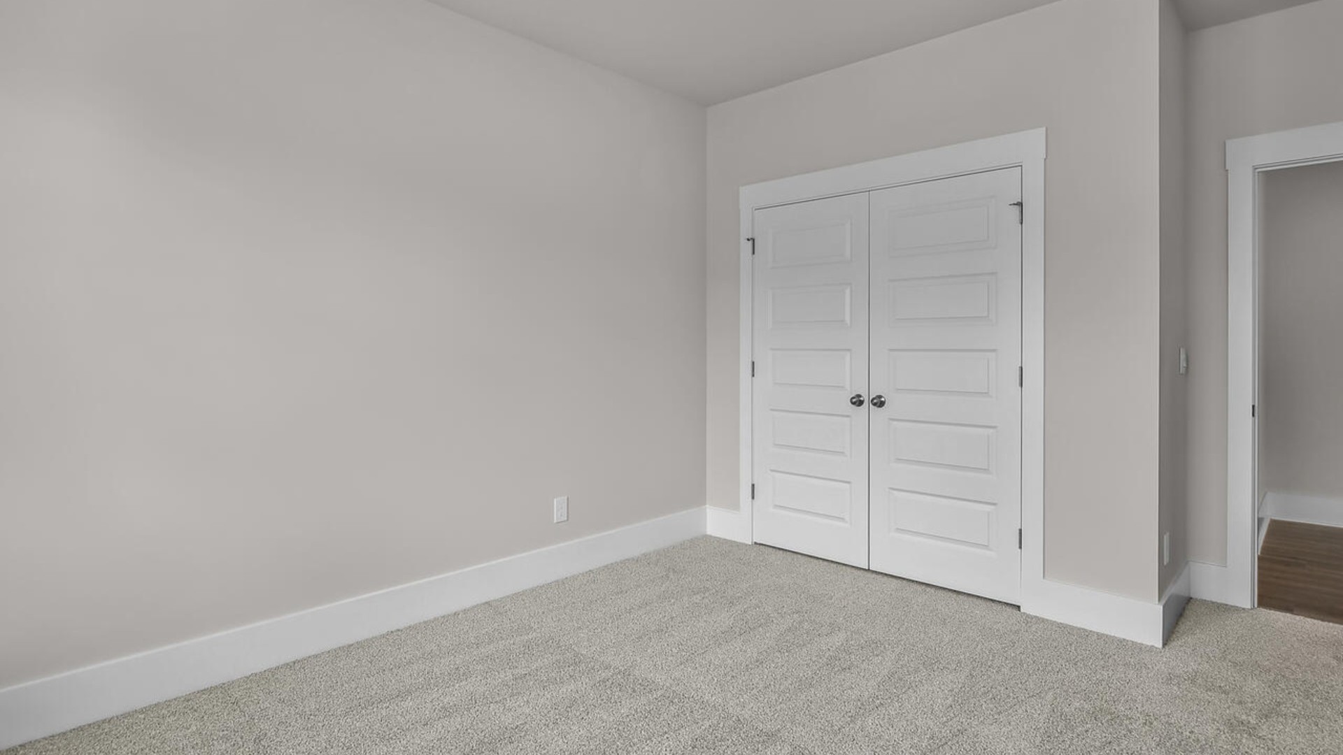 The primary suite features a walk-in closet, trayed ceiling, a step-in 5-foot shower, dual vanity with granite countertops, and natural light in the bathroom