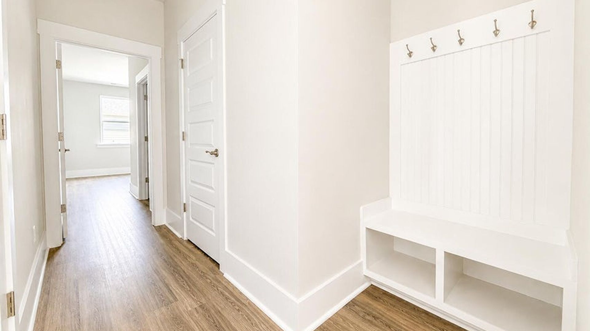 The main level is uniquely designed with a private secondary bedroom (Bedroom 2) located away from the main living traffic, making it an ideal guest suite or quiet home office