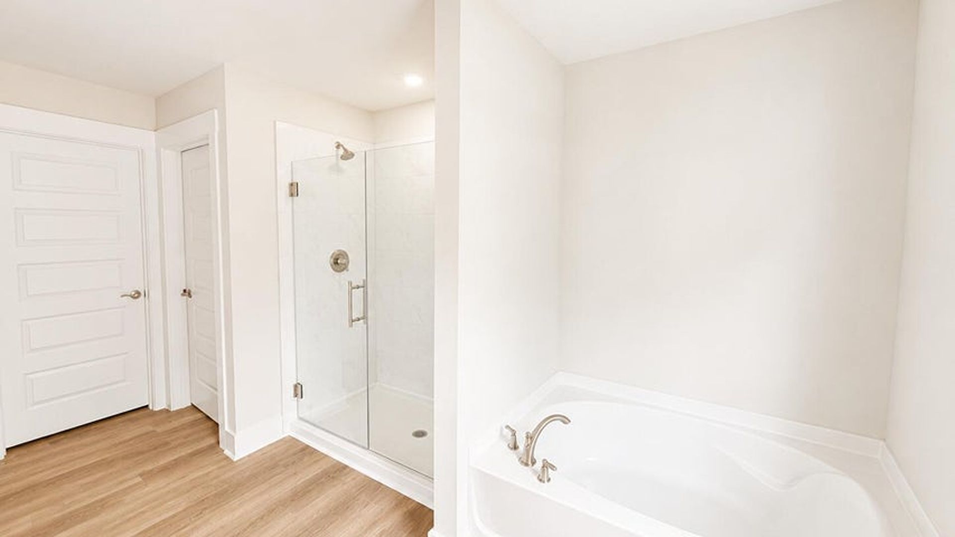 The main level is uniquely designed with a private secondary bedroom (Bedroom 2) located away from the main living traffic, making it an ideal guest suite or quiet home office