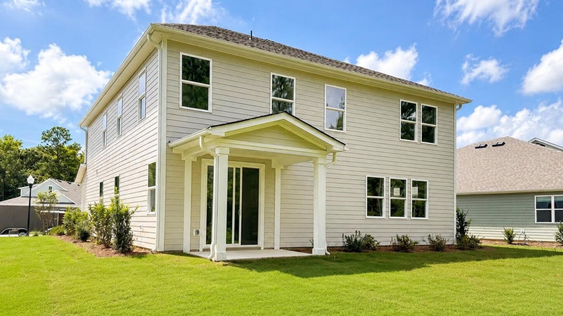 Step through the inviting covered porch into a dedicated foyer, setting a polished tone for the rest of the residence