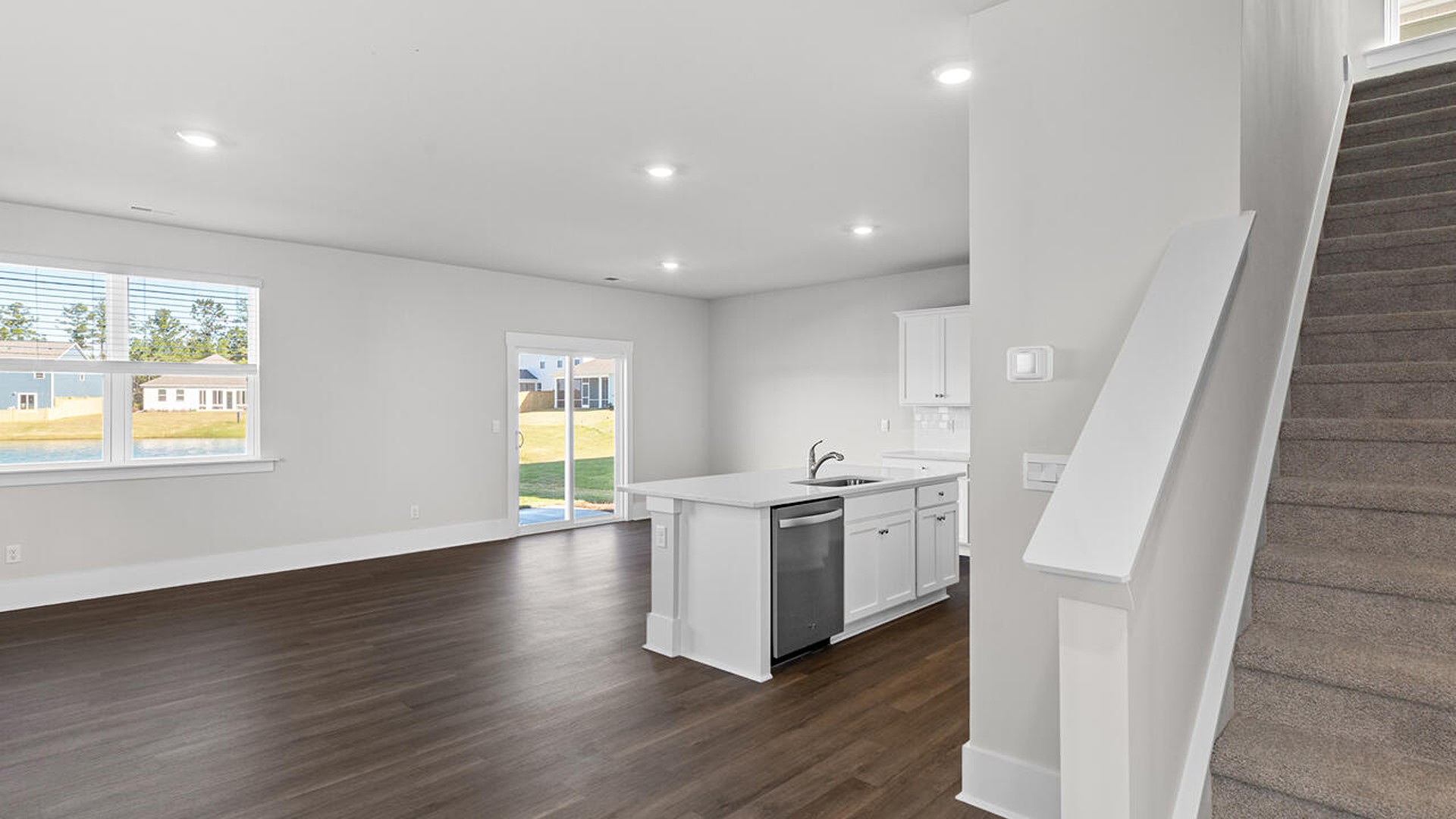 This new home features 9 ft. ceilings, beautiful quartz kitchen countertops, granite countertops in the two full bathrooms