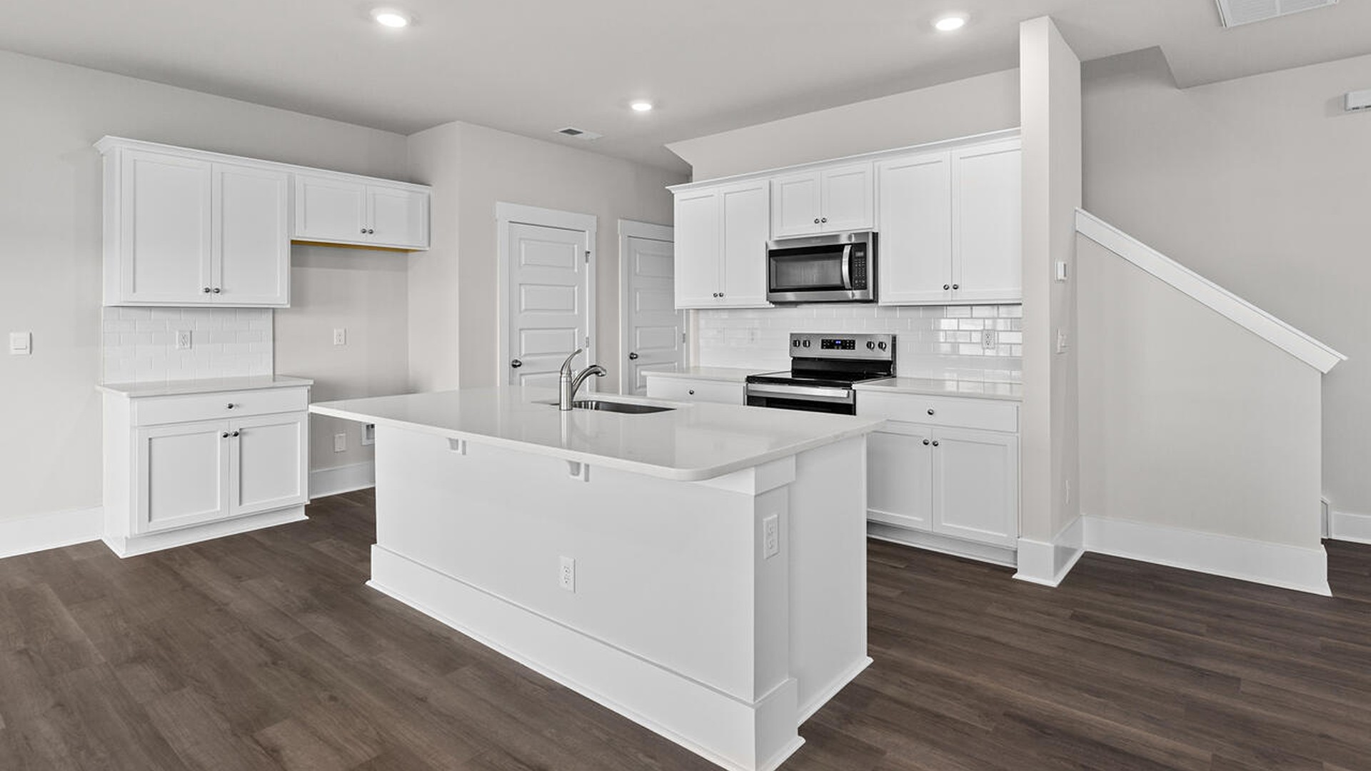 This new home features 9 ft. ceilings, beautiful quartz kitchen countertops, granite countertops in the two full bathrooms