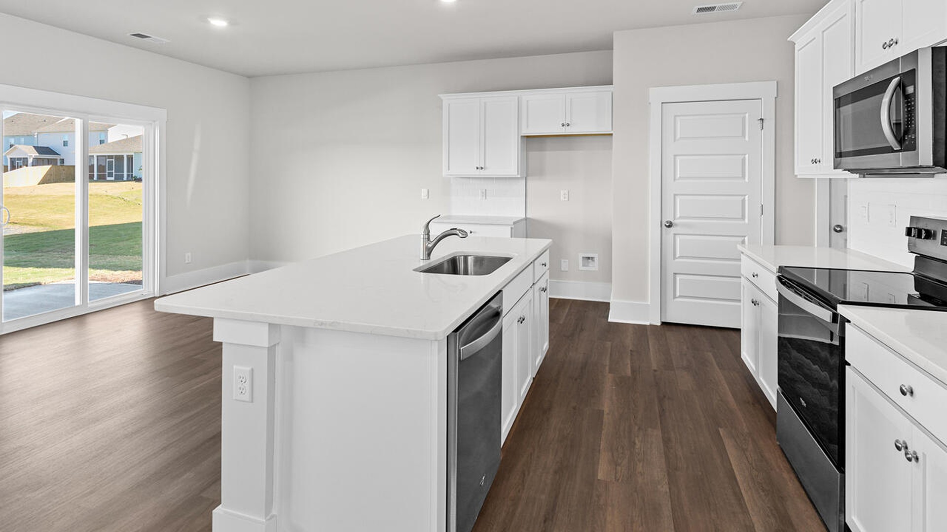This new home features 9 ft. ceilings, beautiful quartz kitchen countertops, granite countertops in the two full bathrooms