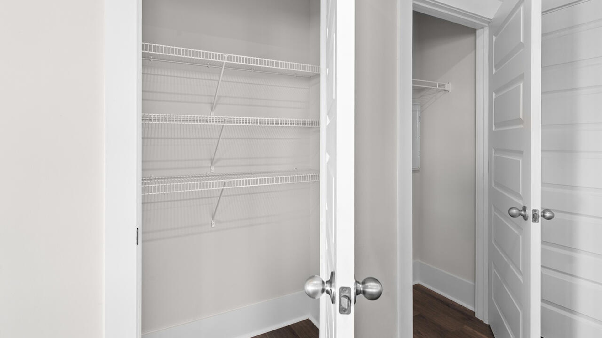 The kitchen features shaker-style cabinets, quartz countertops, and stainless steel appliances, which are sure to both turn heads and make meal prep easy. You’ll never be too far from the action with the living and dining area right there.